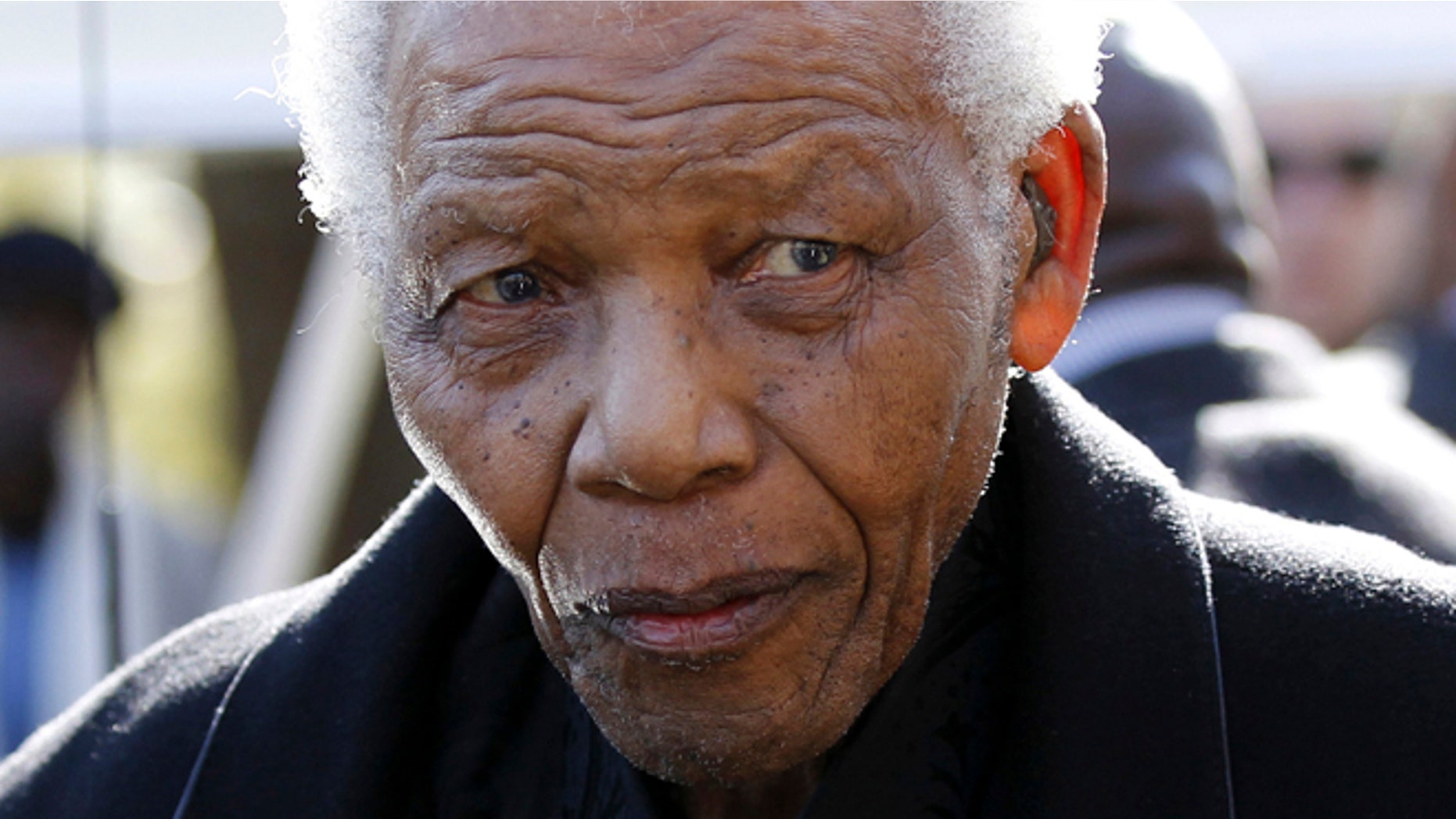 June 17, 2010: Former South African President, Nelson Mandela leaves the chapel after attending the funeral of his great-granddaughter Zenani Mandela in Johannesburg, South Africa.