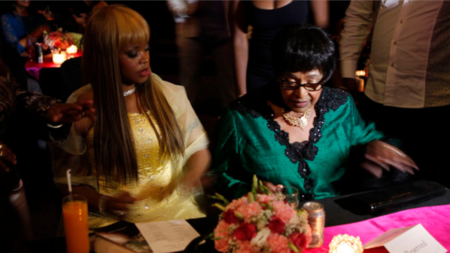 Nov. 12, 2013: Author Zoleka Mandela, left, granddaughter of former president Nelson Mandela, and Winnie Madikizela-Mandela, right, Nelson Mandela's former wife, attends the launch of Zoleka's book "When Hope Whispers," in Johannesburg.