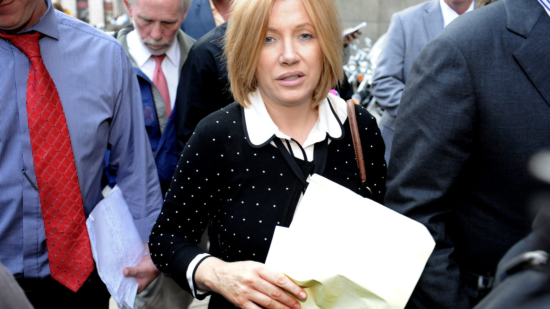 Sept. 25, 2012: Anna Gristina exits Manhattan criminal court in New York.The suburban mother of four charged with moonlighting as a multimillion-dollar madam pleaded guilty Tuesday to promoting prostitution.