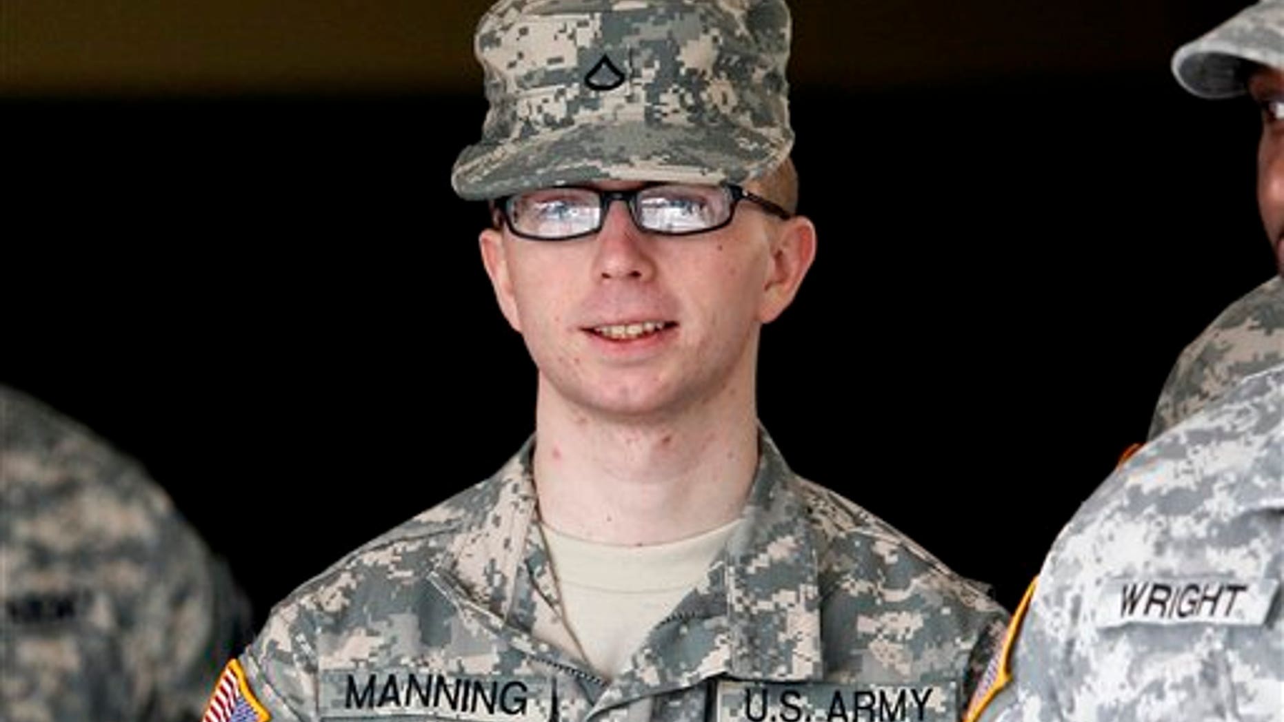 Dec. 22, 2011: Army Pfc. Bradley Manning is escorted from a courthouse in Fort Meade, Md.