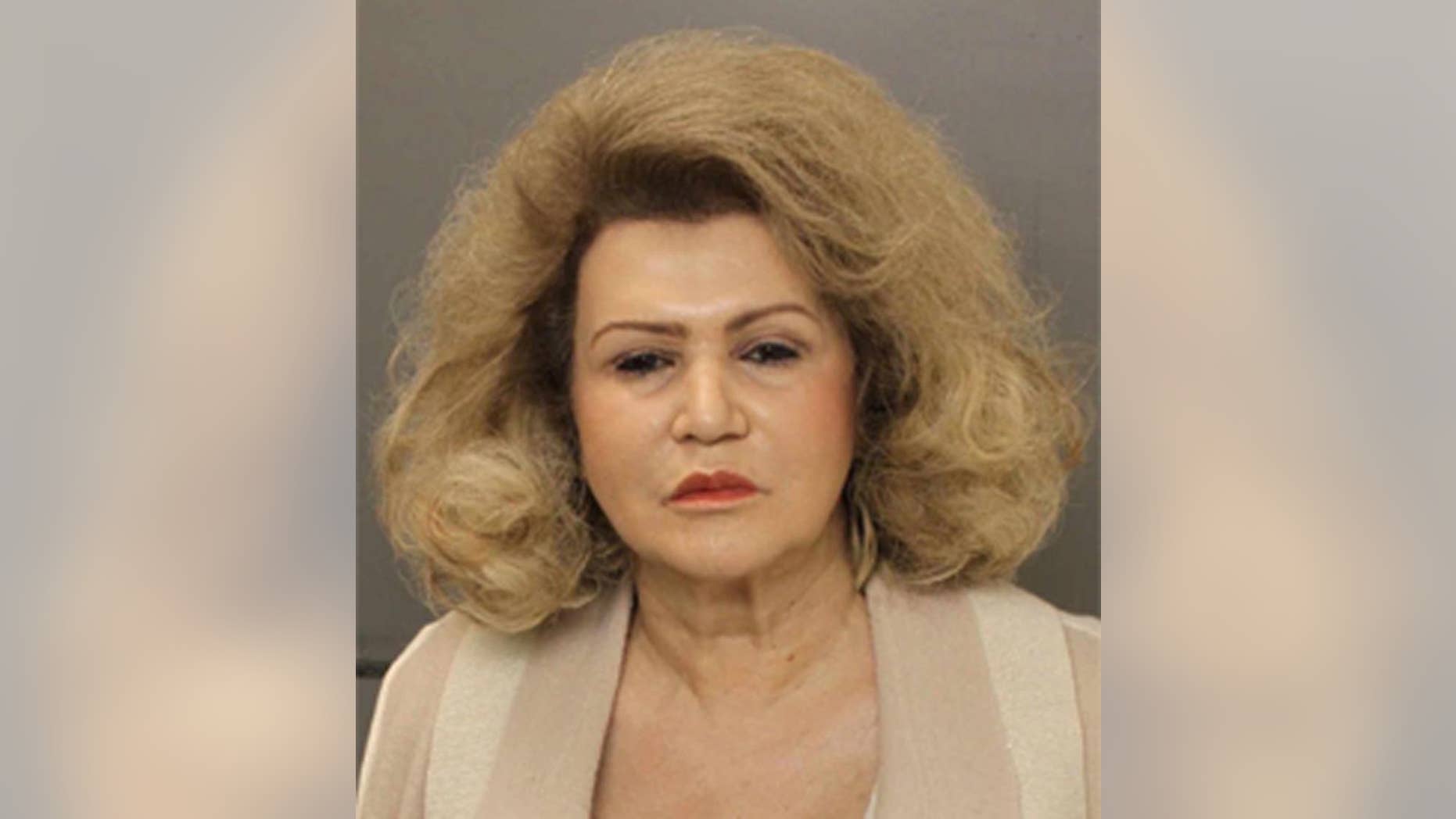 This undated photo provided by the Pennsylvania Office of Attorney General shows Claire Risoldi. The state attorney general's office announced, Thursday, Jan. 22, 2015, the arrest of the 67-year-old Risoldi and four relatives. Counts against Risoldi include conspiracy, witness intimidation and forgery. The investigation began after a 2013 fire at Risoldi's mansion near Philadelphia. It was the third blaze in five years. (AP Photo/Pennsylvania Office of Attorney General)