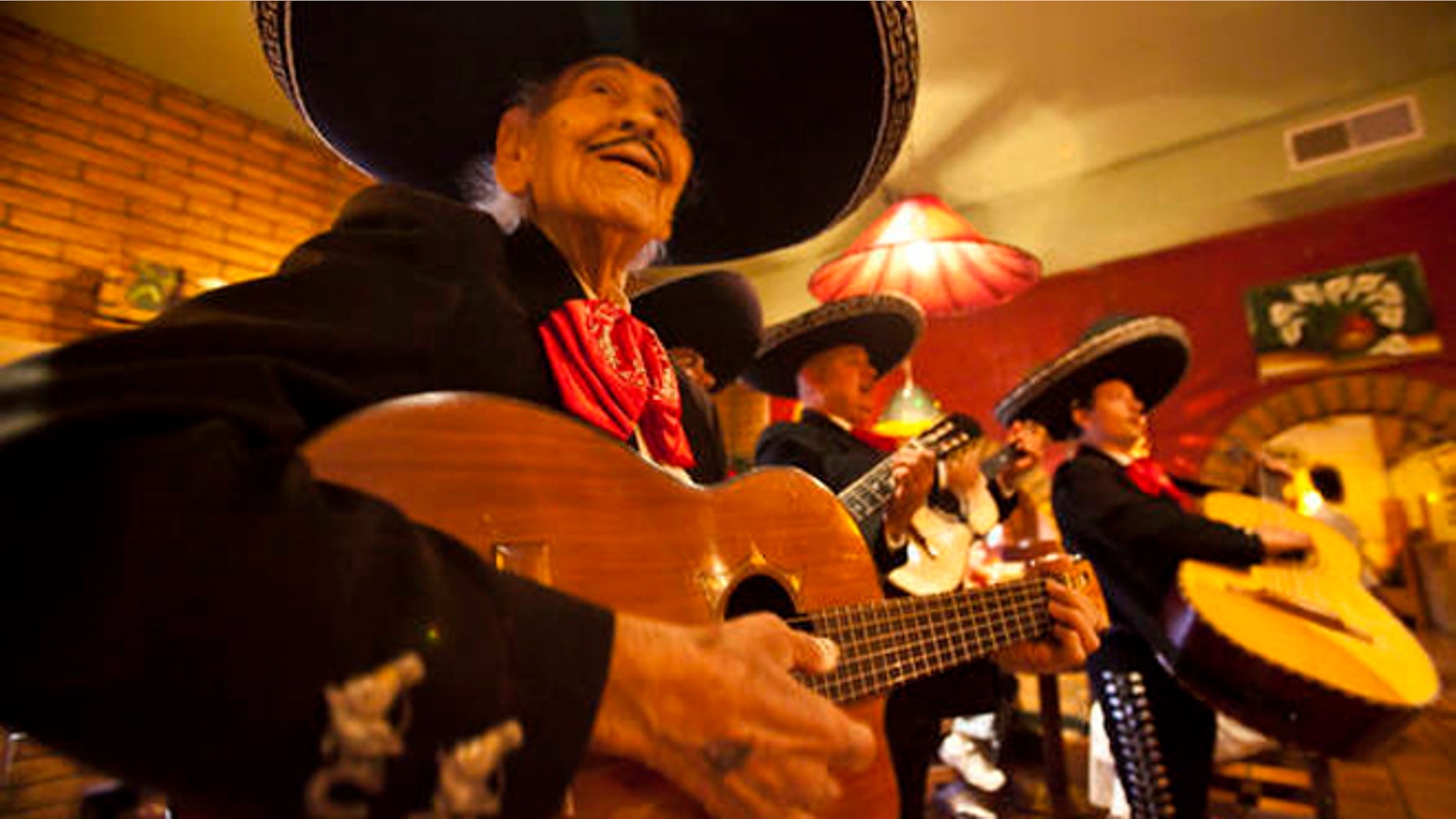 April 13: Singer Manuel Gonzalez, 91, performs with the mariachi band Del Monte at Rio Mirage Cafe and Cantina in El Mirage, Ariz. (AP Photo/The Arizona Republic, Michel Duarte)