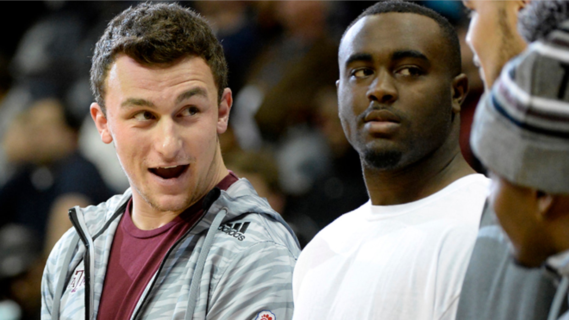 Dec. 28: Texas A&M quarterback Johnny Manziel, left, joins his Aggies teammates as they participate in a halftime basketball skills competition against Duke as part of the Chick-fil-A Bowl NCAA in Atlanta.