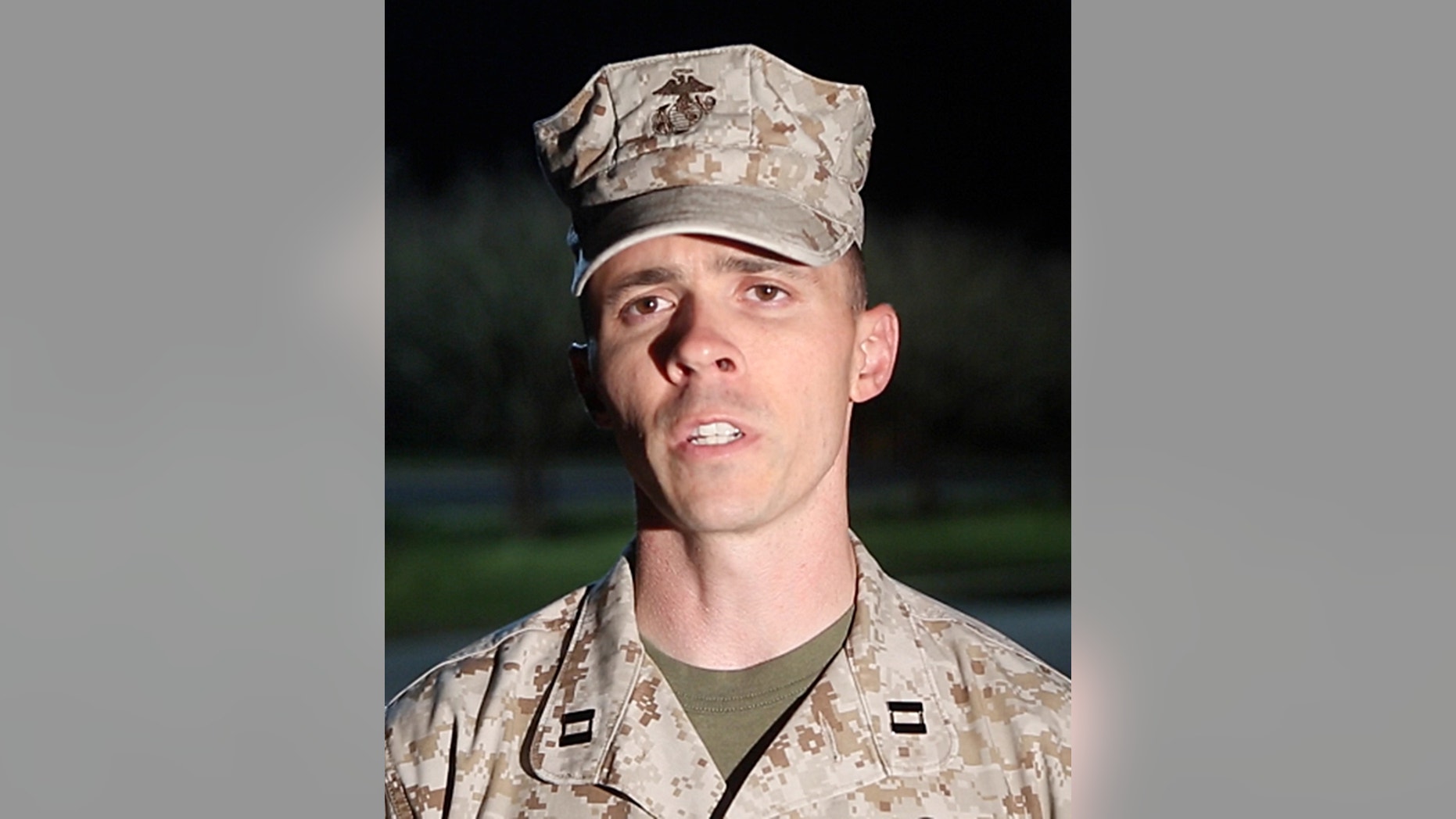 Capt. Joshua Smith, public affairs officer for Marine Corps Installations East, Camp Lejeune, Jacksonville, comments on the recent shooting Tuesday April 8, 2014 at Camp Lejeune. A Marine posted at the main gate of the North Carolina base shot and killed a colleague inside a guard shack Tuesday, a military spokesman said. (AP Photo/John Althouse/The Daily News)