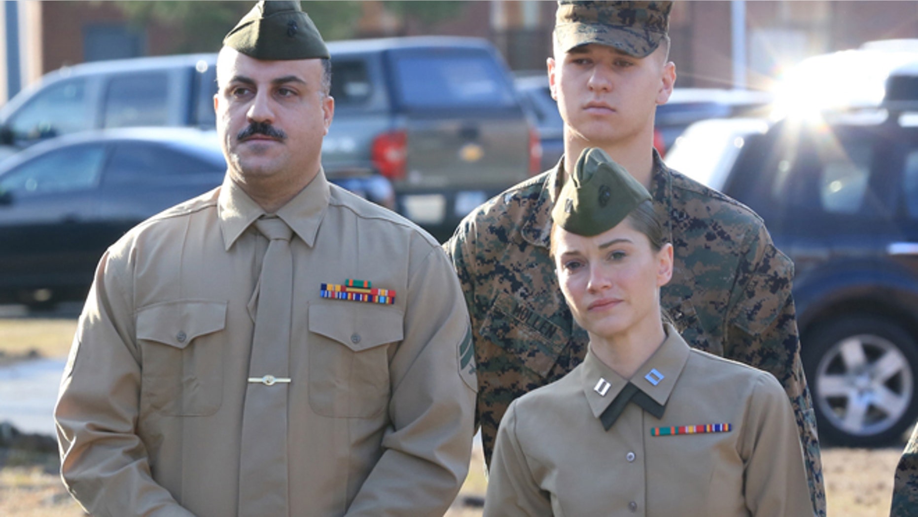 Feb. 9, 2015: Cpl. Wassef Hassoun, left, is escorted to the courtroom on Camp Lejeune in Jacksonville, N.C., for the beginning of his court martial trial. (AP/The Daily News, John Althouse)