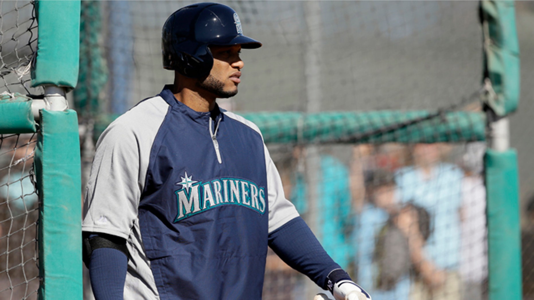 Seattle Mariners' Robinson Cano walks out of the batting cage after hitting during spring training baseball practice, Thursday Feb. 20, 2014, in Peoria, Ariz. (AP Photo/Tony Gutierrez)