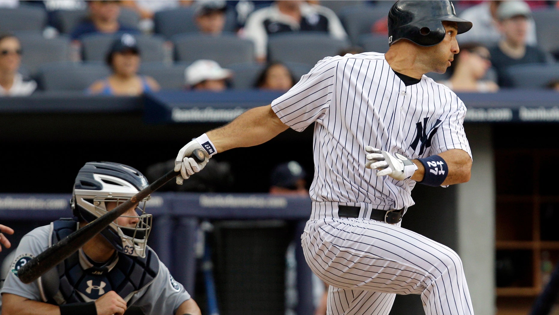 New York Yankees' Raul Ibanez swings on a two-run single in the sixth inning of their baseball game against the Seattle Mariners at Yankee Stadium in New York, Sunday, Aug. 5, 2012. (AP Photo/Kathy Willens)