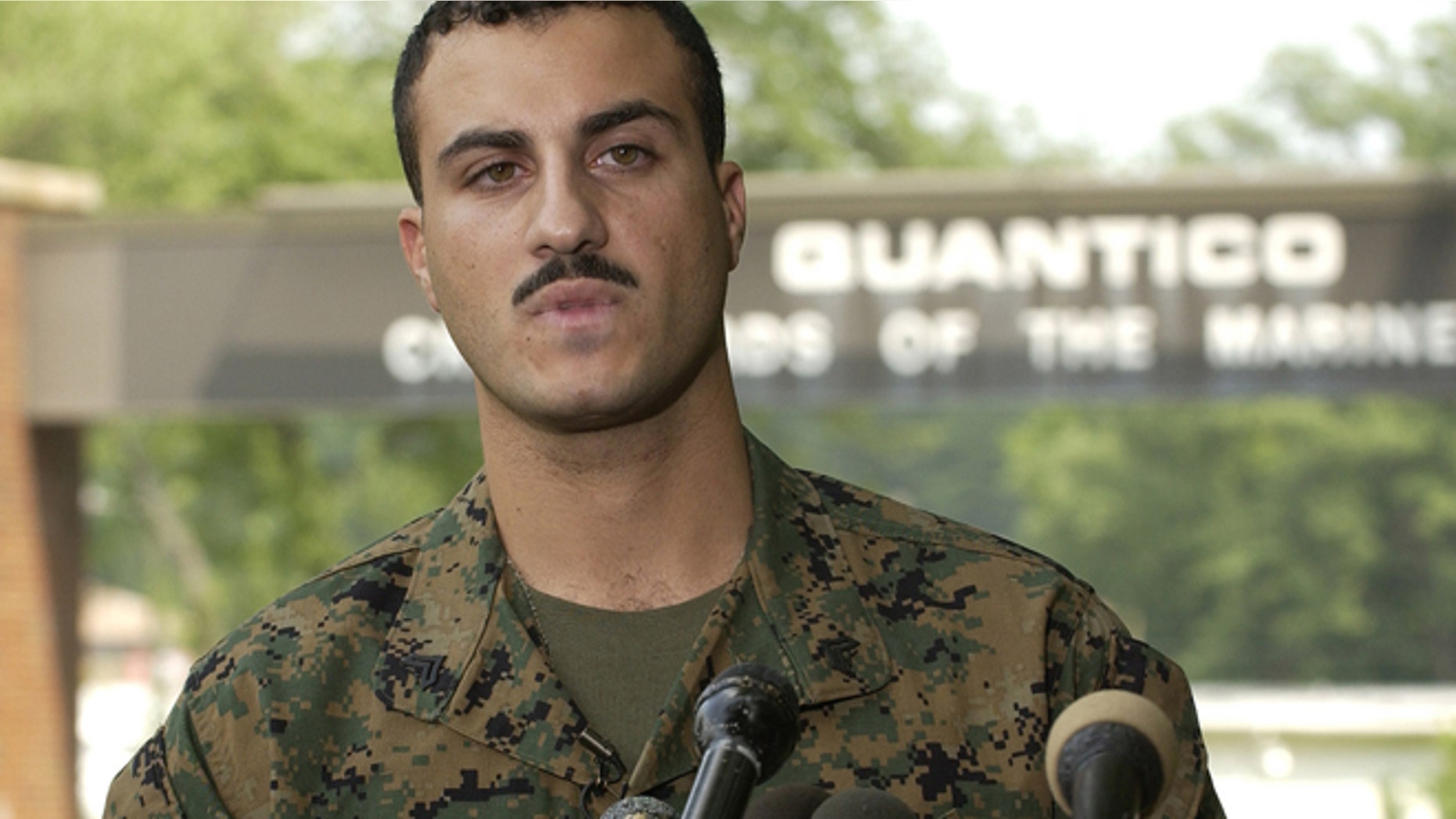 July 19, 2004: U.S. Marine Corps Corporal Wassef Ali Hassoun reads a prepared statement outside the gate at Quantico Marine Corps Base in Northern Virginia, 35 miles south of Washington. (Reuters)