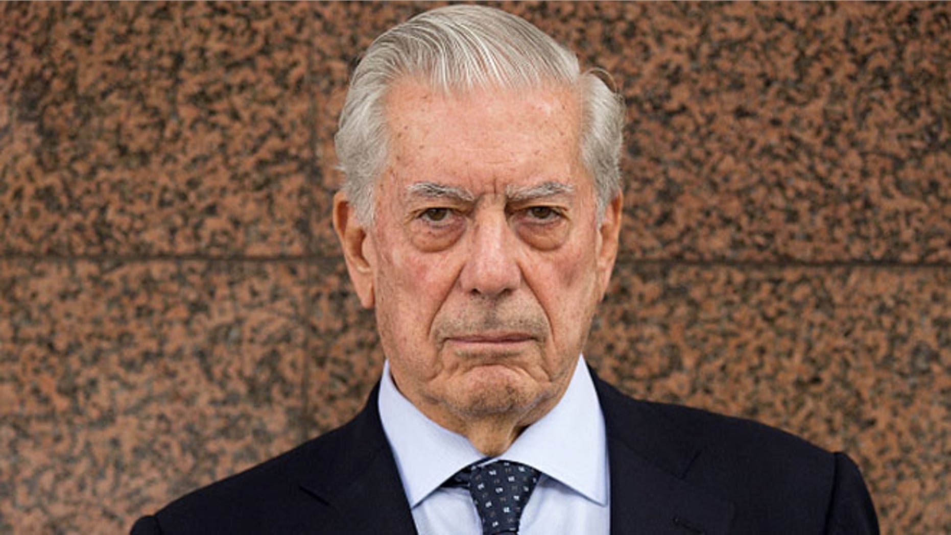 MADRID, SPAIN - JUNE 09: Nobel prize-winning writer Mario Vargas Llosa poses for a picture prior to attend the 7th edition of the 'Catedra Real Madrid' Project at Santiago Bernabeu Stadium outdoors on June 9, 2015 in Madrid, Spain. (Photo by Gonzalo Arroyo Moreno/Getty Images)