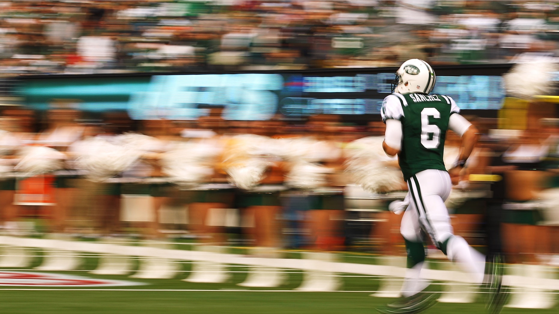 EAST RUTHERFORD, NJ - NOVEMBER 27: Mark Sanchez #6 of the New York Jets runs onto the field before the game against the Buffalo Bills during their pre season game on November 27, 2011 at MetLife Stadium in East Rutherford, New Jersey. (Photo by Al Bello/Getty Images)