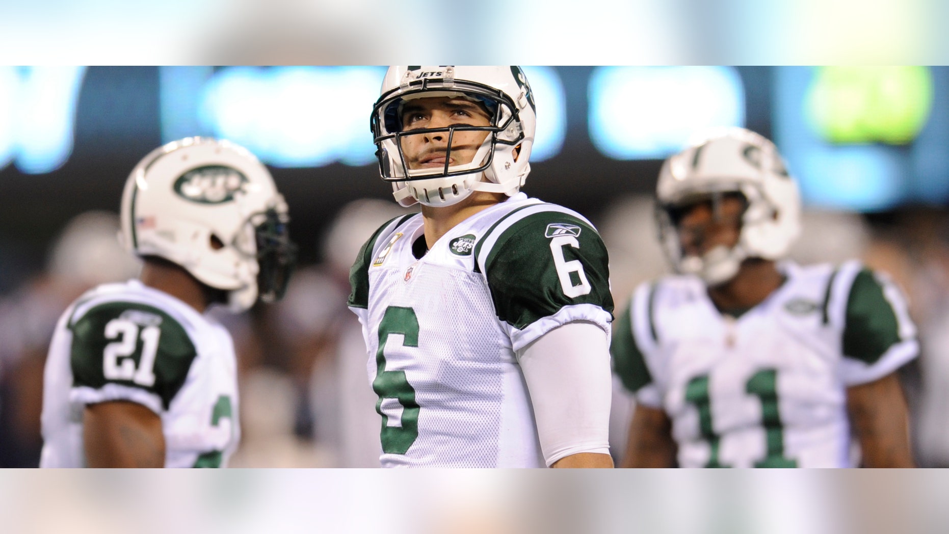 New York Jets quarterback Mark Sanchez (6) looks on with teammates LaDainian Tomlinson (21) and Jeremy Kerley (11) during the fourth quarter of an NFL football game, Sunday, Nov. 13, 2011, in East Rutherford, N.J. The Jets lost the game 37-16. (AP Photo/Bill Kostroun)