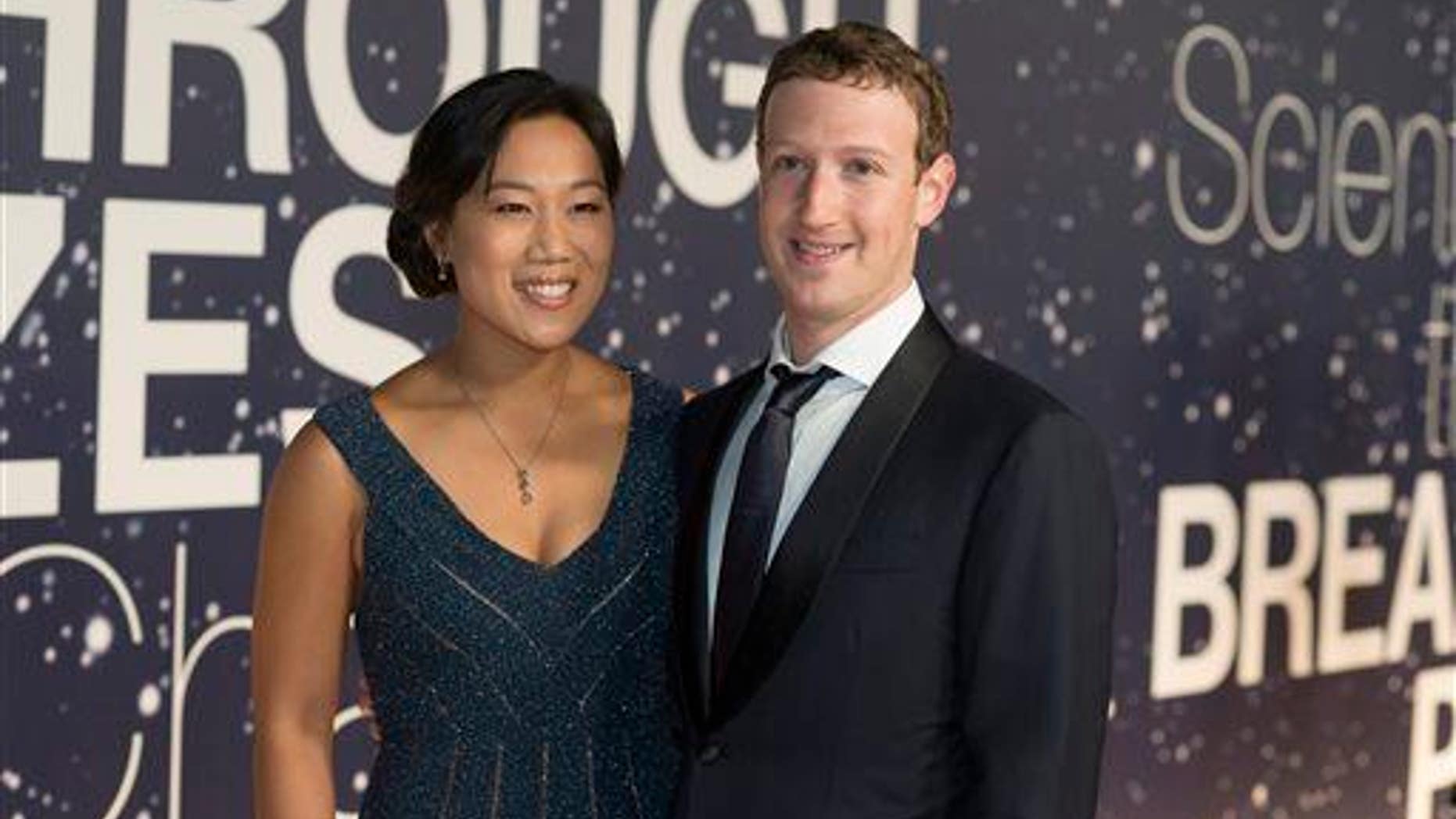 Priscilla Chan and Mark Zuckerberg arrive at the 2nd Annual Breakthrough Prize Award Ceremony at the NASA Ames Research Center on Nov. 9, 2014, in Mountain View, California.