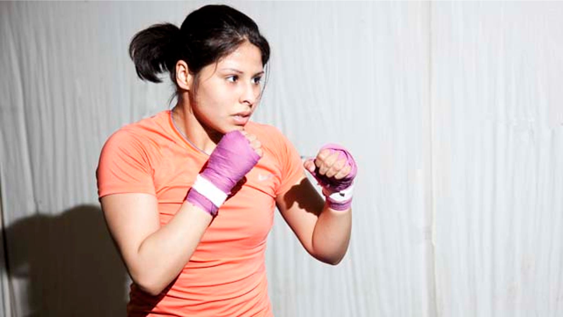 Marlen Esparza, a Houston-based boxing, is fighting to make history at the 2012 Olympics.