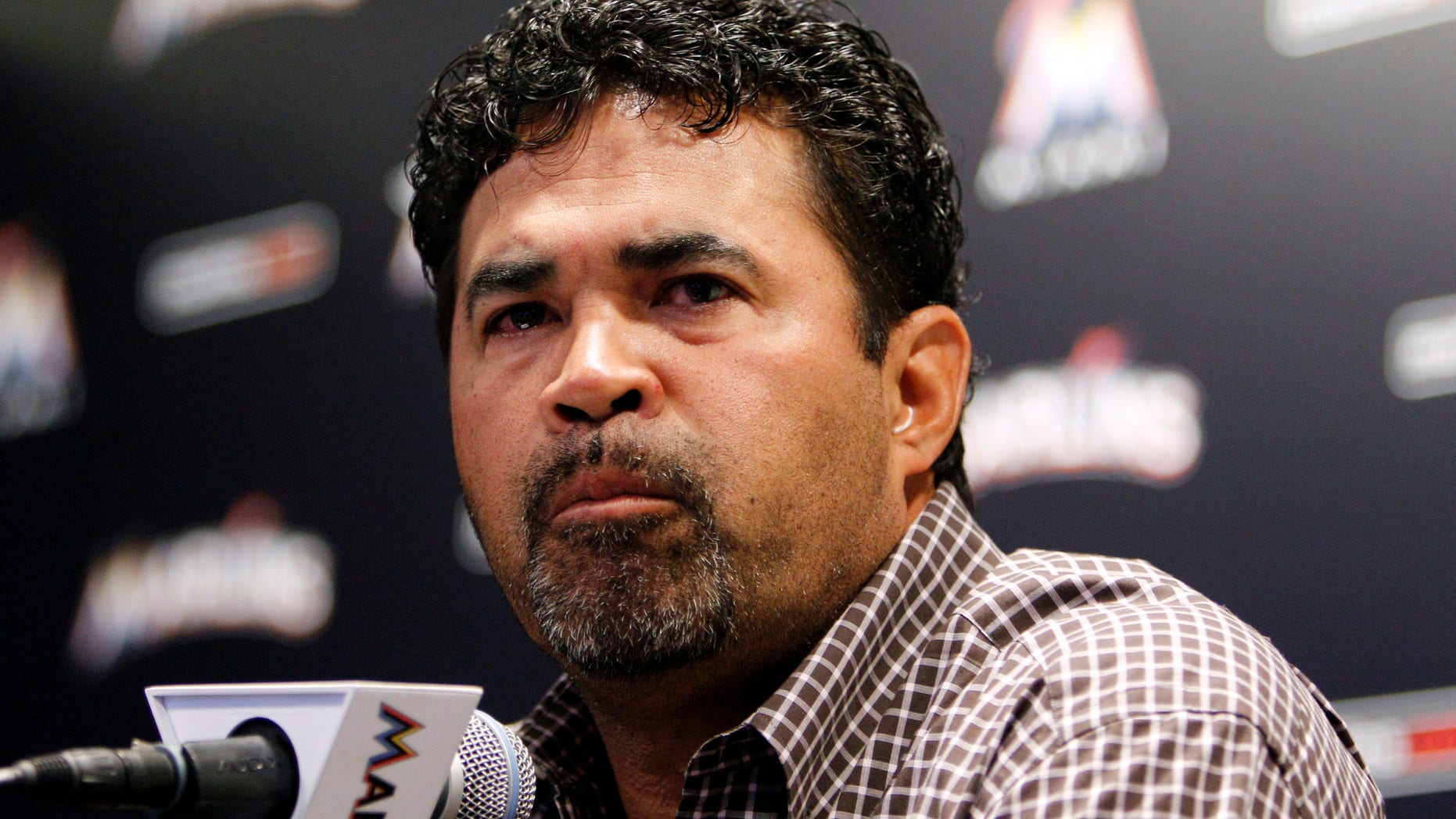 April 10. 2012: Miami Marlins manager Ozzie Guillen pauses as he speaks at a news conference at Marlins Stadium in Miami, Tuesday April 10, 2012.