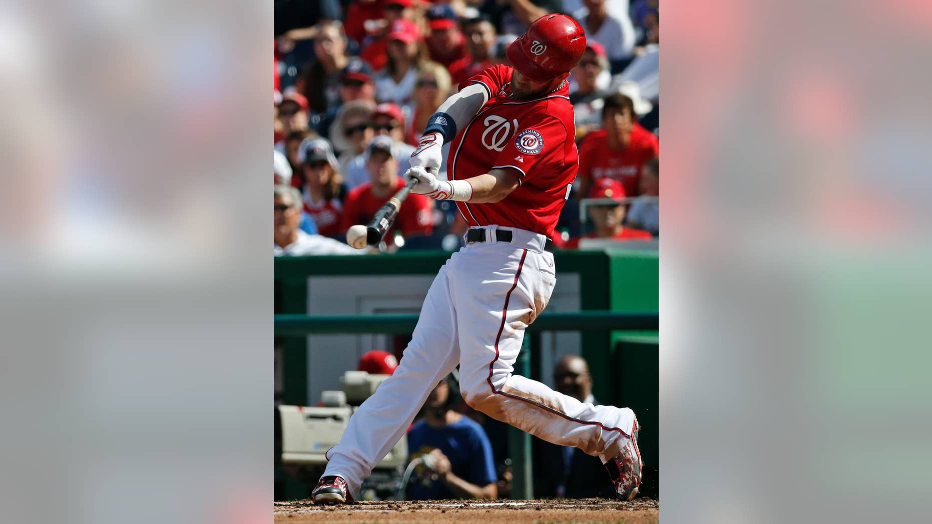 Washington Nationals' Bryce Harper hits a single during the fourth inning of a baseball game against the Miami Marlins, Sunday, Sept. 28, 2014, in Washington. (AP Photo/Alex Brandon)