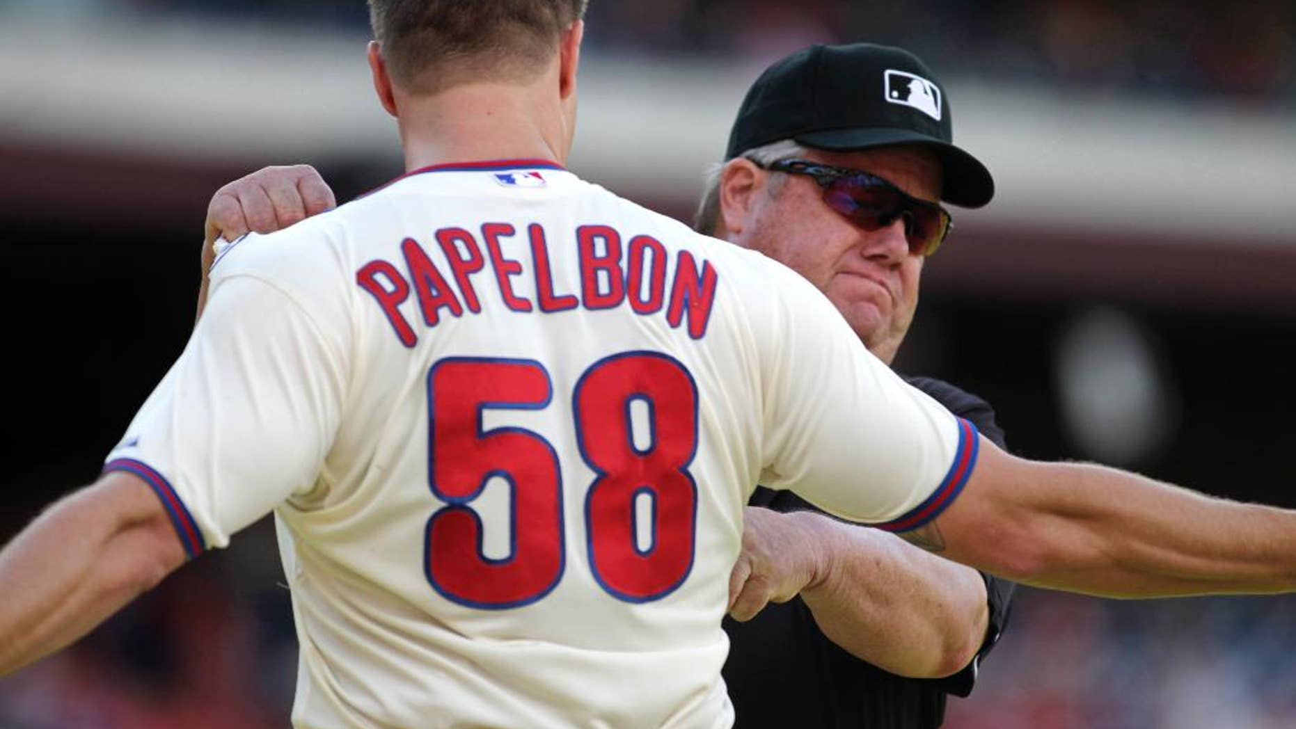 Philadelphia Phillies pitcher Jonathan Papelbon argues with Umpire Joe West after being ejected from the game against the Miami Marlins in the ninth inning of a baseball game Sunday, Sept. 14, 2014, in Philadelphia. The Marlins won 5-4. (AP Photo/H. Rumph Jr)