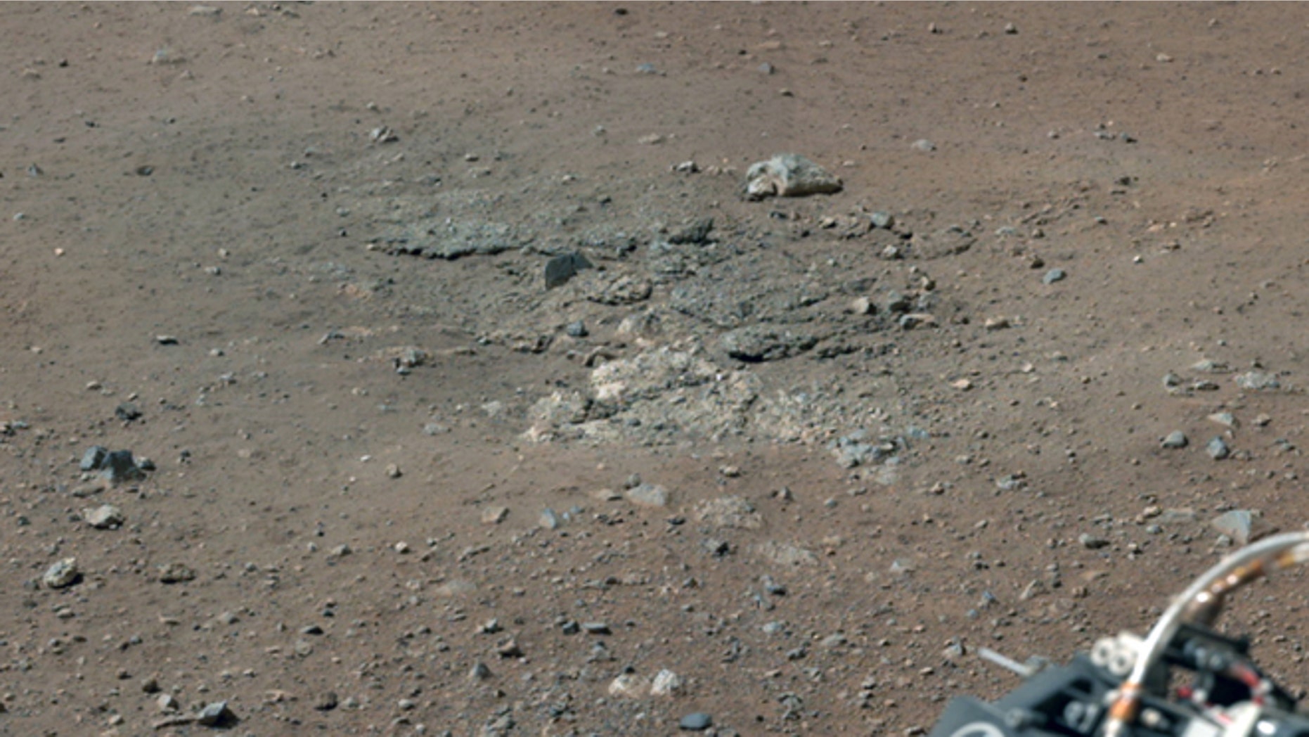 Aug. 17,2012: This image shows bedrocks that was exposed after Curiosity's rocket stage fired its engines that blew away soil from the Martian surface.