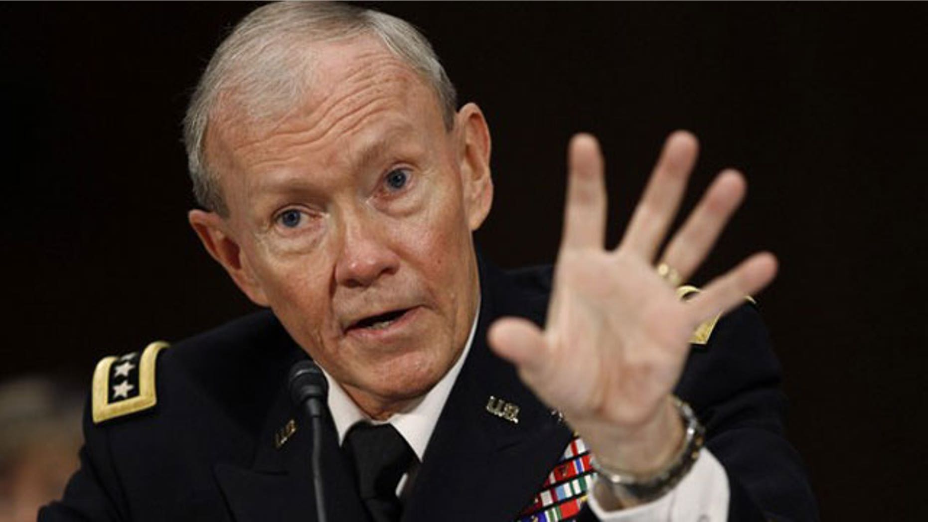 July 26: U.S. Army General Martin Dempsey speaks at his confirmation hearing for Chairman of the Joint Chiefs of Staff, on Capitol Hill in Washington.