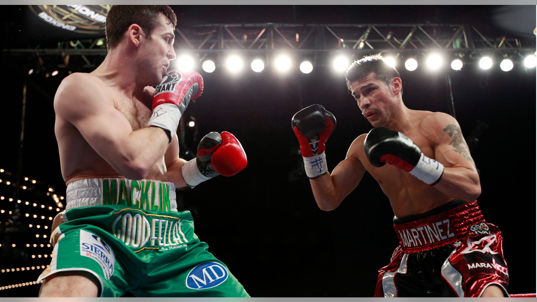 Matthew Macklin, left, and Sergio Martinez eye each other during the second round of a middleweight boxing bout Saturday, March 17, 2012, in New York. Martinez won the fight when it was stopped after the 11th round. (AP Photo/Frank Franklin II)