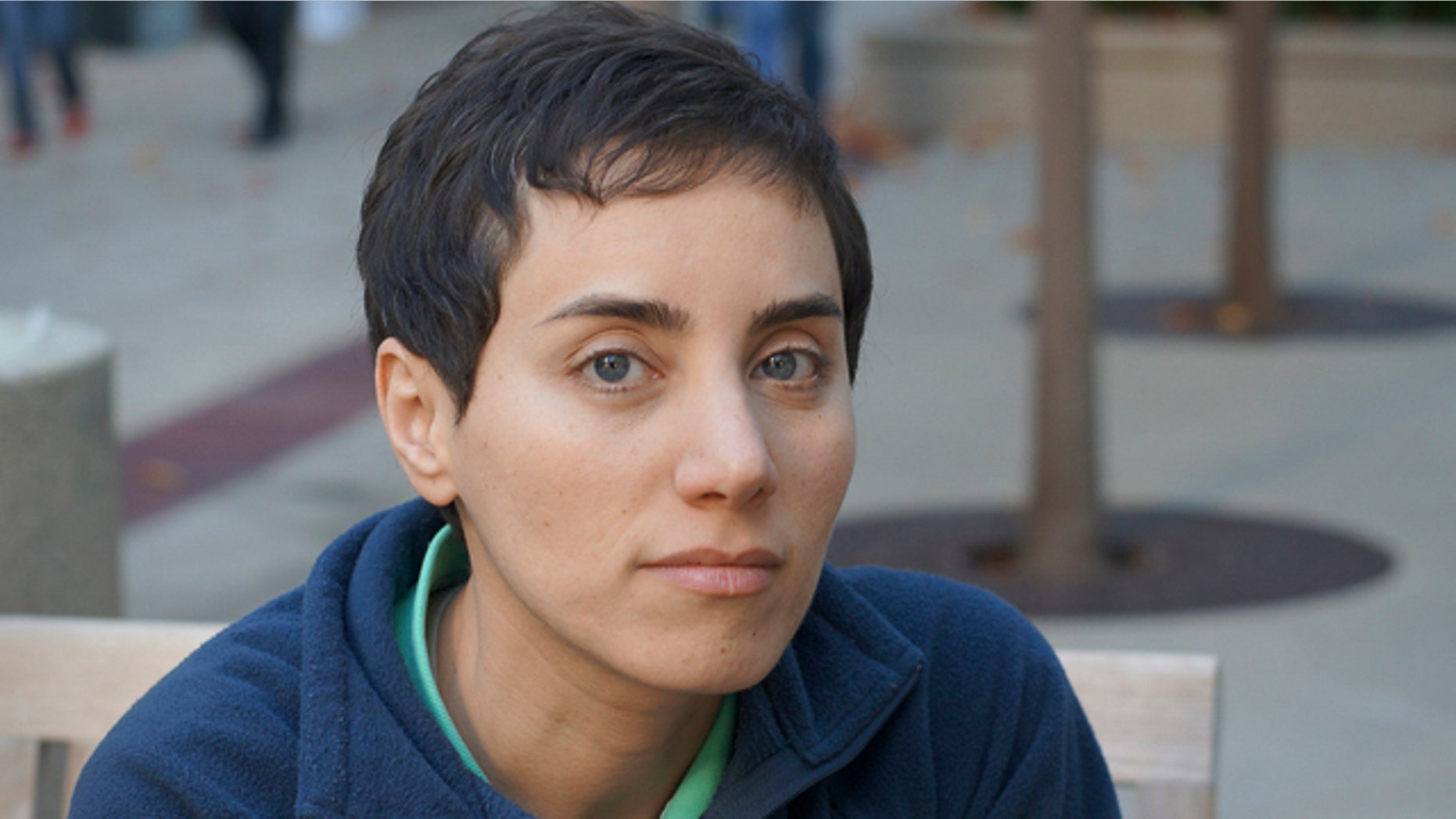 This undated photo provided by Professor Maryam Mirzakhani via Stanford shows her on the university's campus. On Wednesday, Aug. 13, 2014, the Iranian-born Stanford University professor became the first woman to win math's highest honor, the Fields Medal. (AP Photo/Maryam Mirzakhani via Stanford)