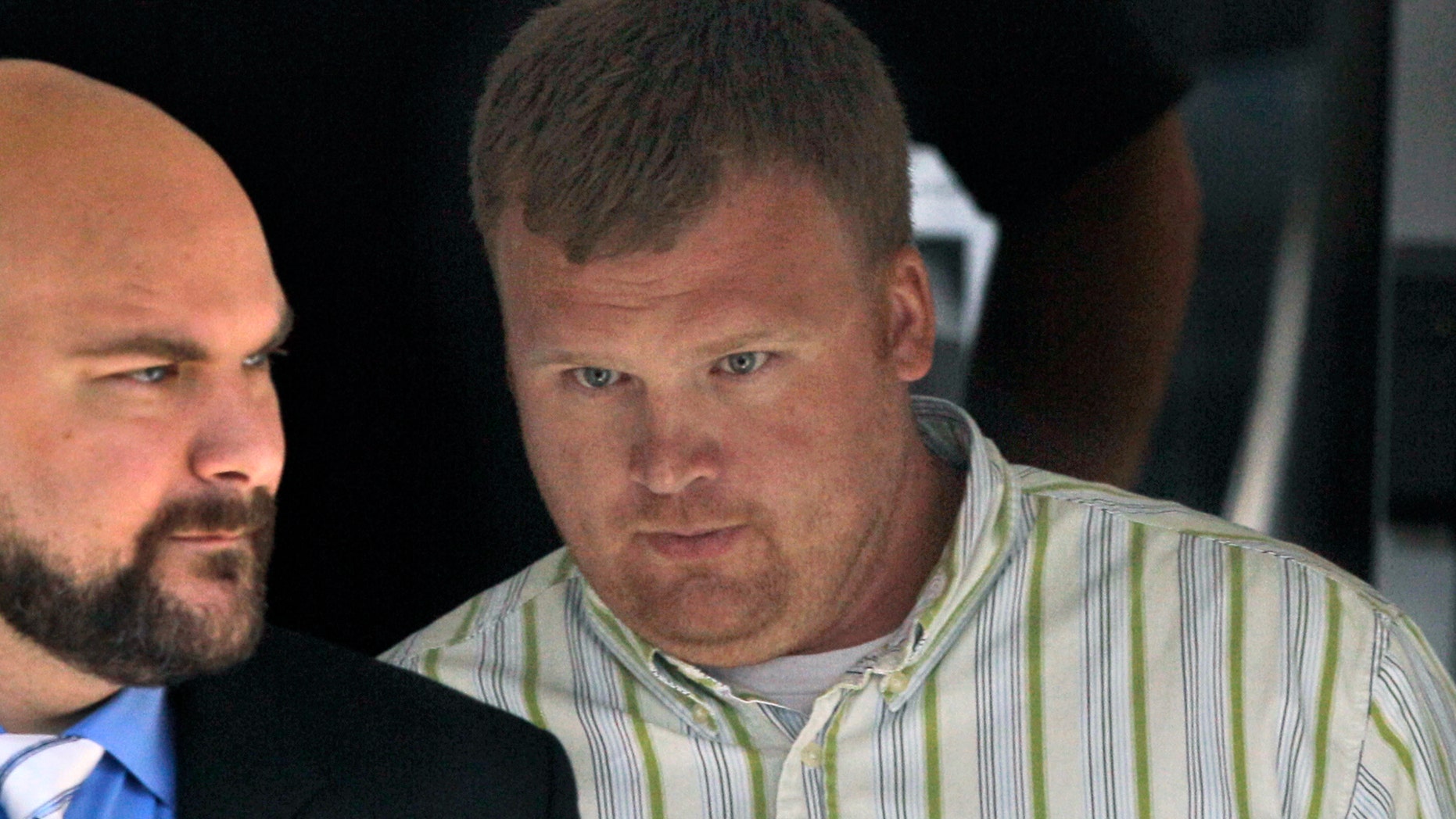 June 20, 2012: Matt Sandusky, right, adopted son of former Penn State assistant coach Jerry Sandusky, leaves the Centre County Courthouse in Bellefonte, Pa.