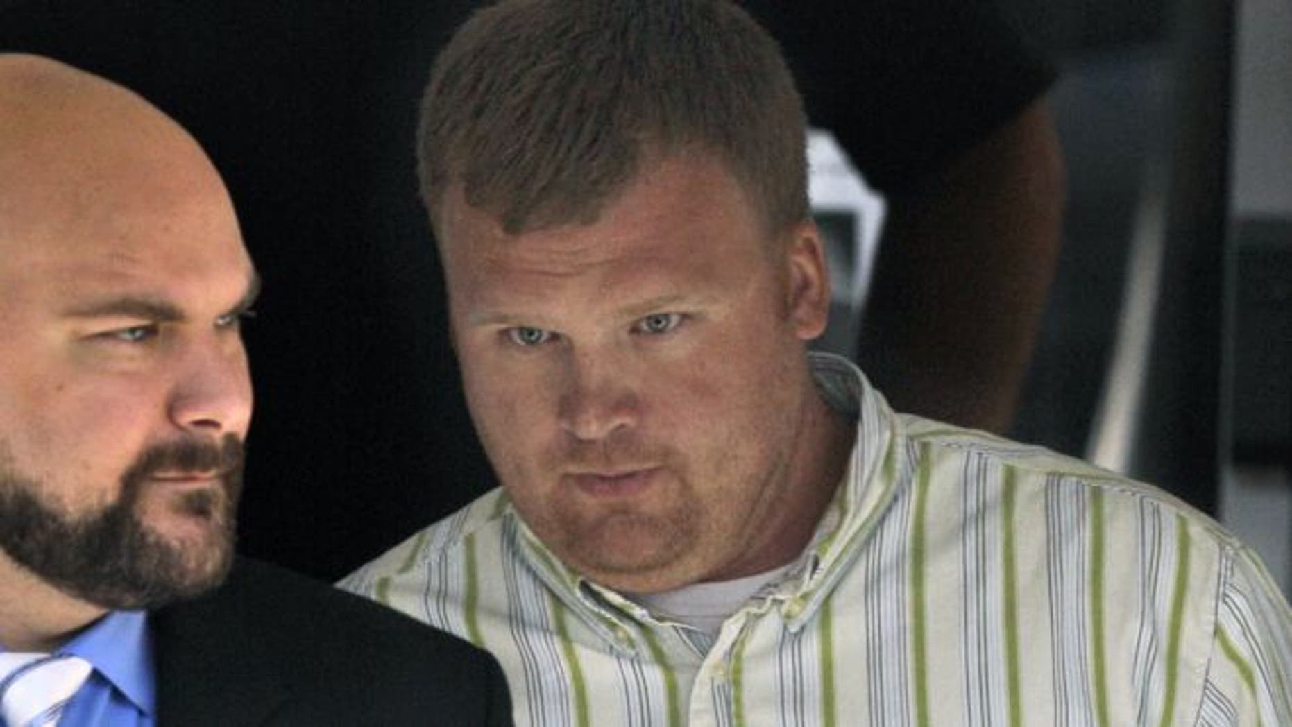 June 20, 2012: Matt Sandusky, right, adopted son of former Penn State assistant coach Jerry Sandusky, leaves the Centre County Courthouse in Bellefonte, Pa.