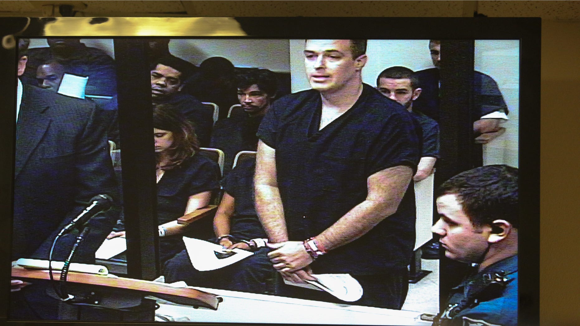 Matthew Apperson makes a first appearance in Seminole County court at the John E Polk correctional facility, seen on a video monitor, in Sanford, Fla. on Saturday May 16, 2015. Apperson was charged Friday with aggravated assault with a deadly weapon, aggravated battery with a deadly weapon and firing a deadly missile into an occupied conveyance stemming from an incident involving George Zimmerman earlier in the week. (Joshua C. Cruey/Orlando Sentinel via AP) MAGS OUT; NO SALES