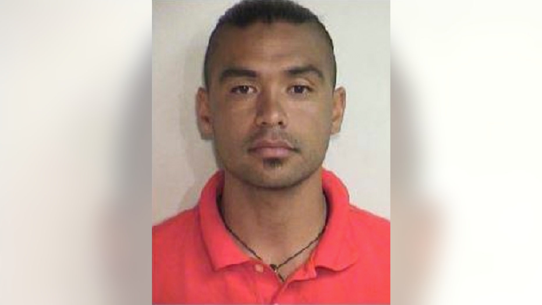 This Aug. 20, 2015 booking photo released by the Maui County Police Department shows Joshua Mangauil, who was one of several people arrested early Thursday, Aug. 20, 2015, during a protest against a Maui solar telescope, in the effort to stop a giant telescope on the Big Island. Protesters gathered Wednesday night to attempt to stop a convoy delivering materials to Haleakala, where the Daniel K. Inouye Solar Telescope is being built. (Maui County Police Department via AP)