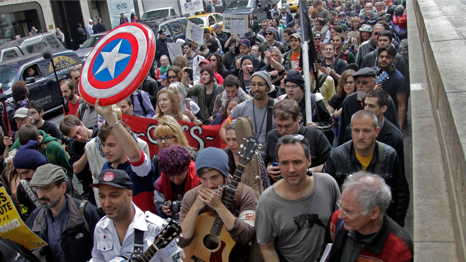 A coalition of activists join Occupy Wall Street in a May Day march from Bryant Park on Tuesday in New York. (AP Photo/Bebeto Matthews)