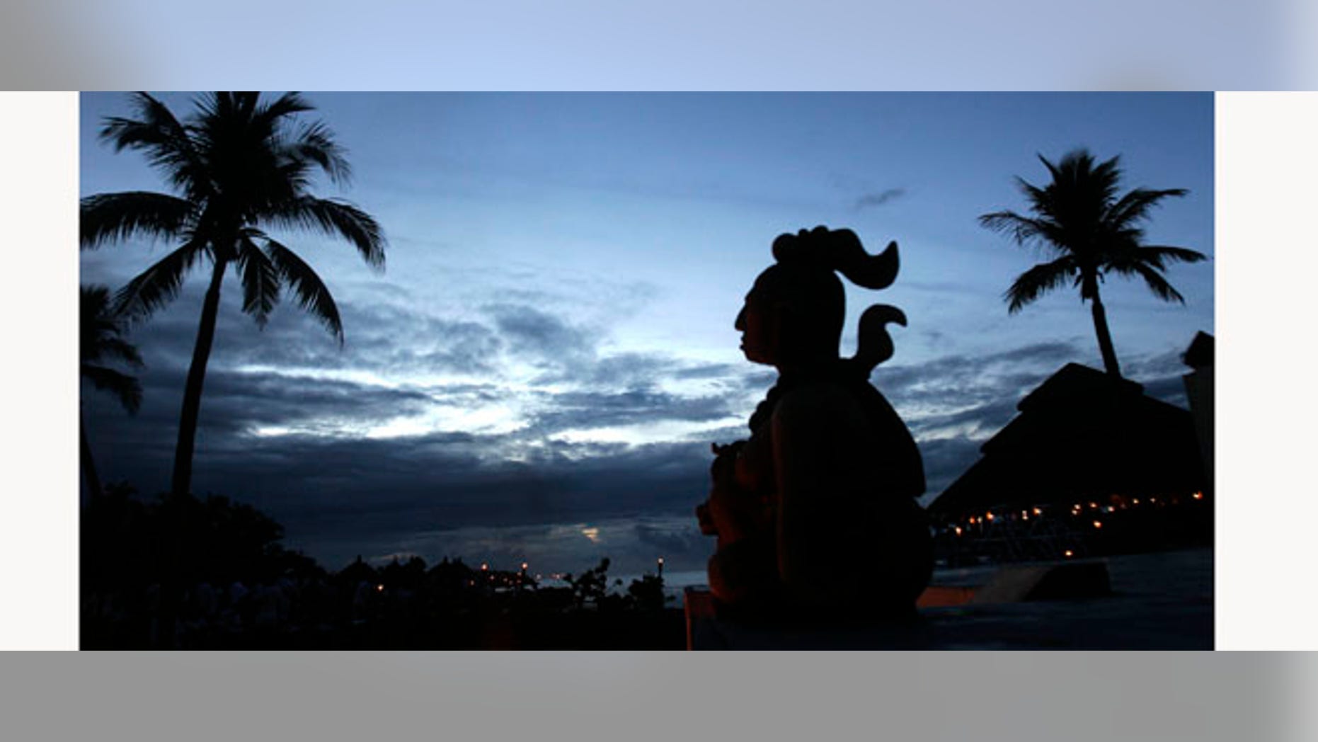 FILE - This June 1, 2007 file photo shows a Mayan statue stands in Playa Del Carmen, Mexico, where people will gather before making their way across the Yucatan Channel, to the Cozumel Island, in a ten mile pilgrimage in honor of the Mayan goddess Ixchel. Only a year is left before Dec. 21, 2012, when some believe the Maya predicted the end of the world. While some doomsday theorists may suggest putting together survival kits, people in southeastern Mexico, the heart of Maya territory, plan to throw a yearlong celebration. And to make a profit while they party.(AP Photo/Israel Leal)