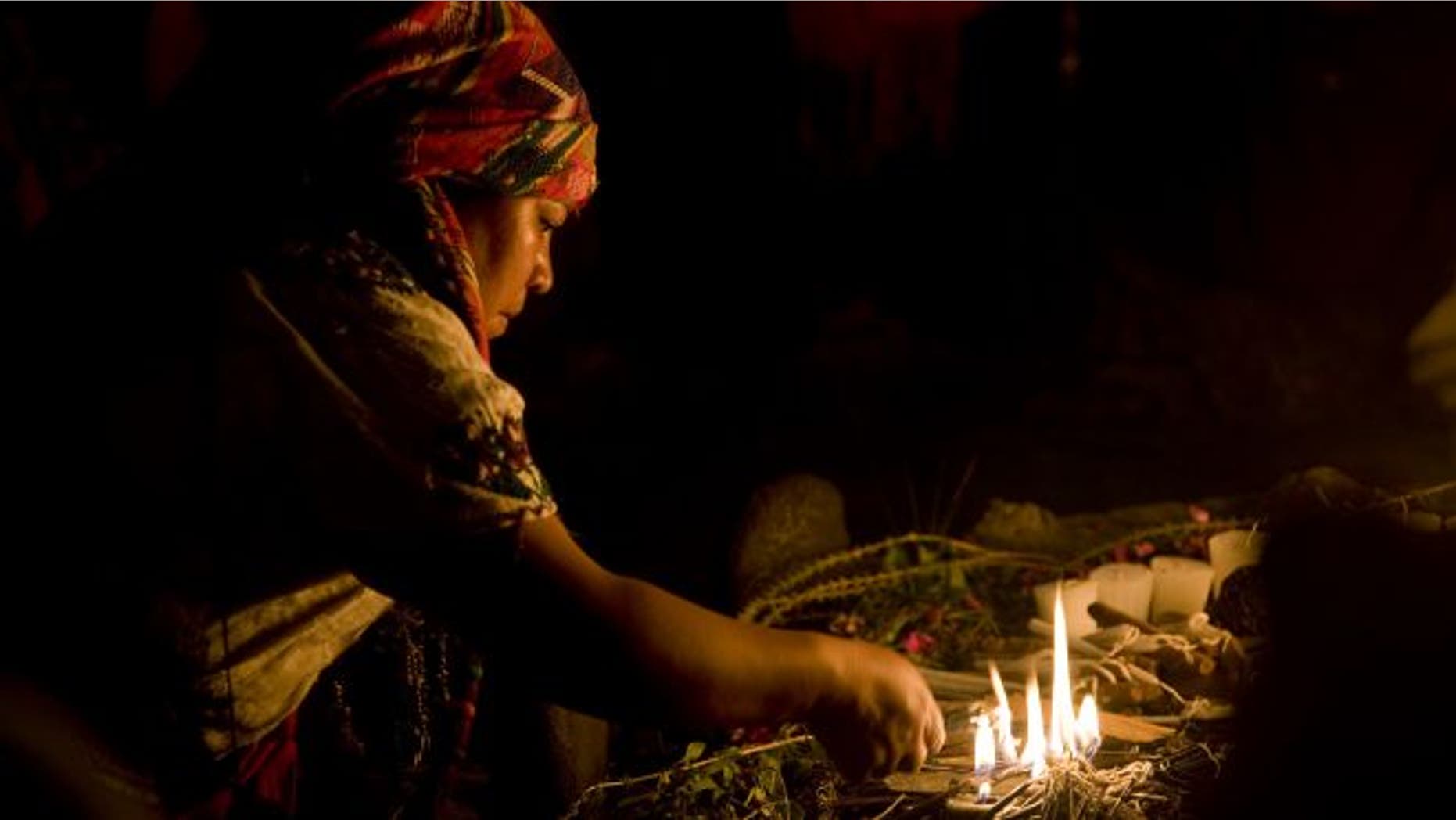 A Mayan priestess prays during a ceremony marking the Mayan solar new year.