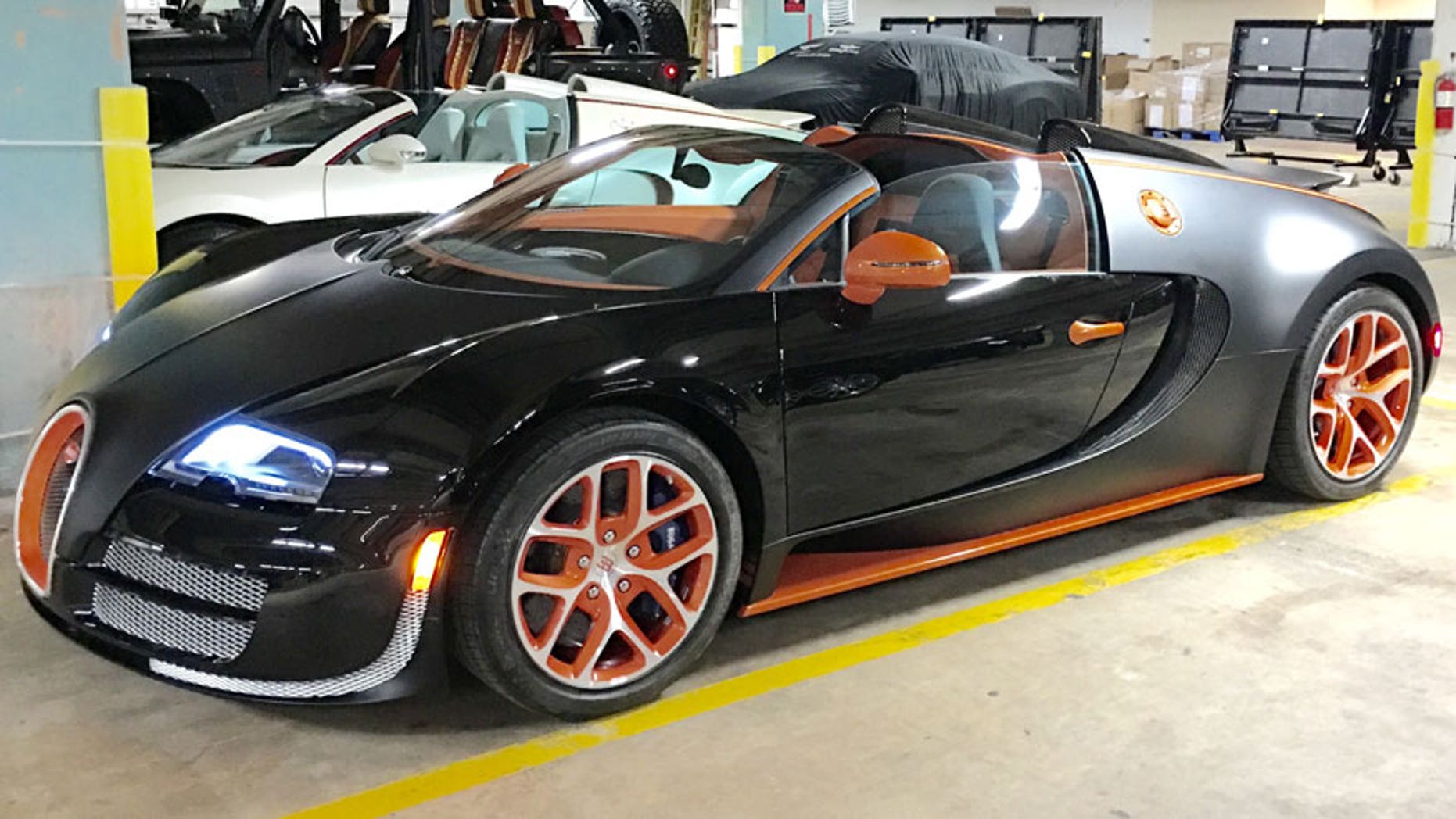 This Oct. 26, 2015 photo provided by Obi Okeke shows a 2015 Bugatti Veyron Grand Sport Vitesse sports car, purchased by boxer Floyd Mayweather Jr., in the parking garage of the Fontainebleau Hotel in Miami Beach, Fla. Mayweather purchased the $3.5 million sports car and posed for a photo with it on Instagram. (Obi Okeke via AP)
