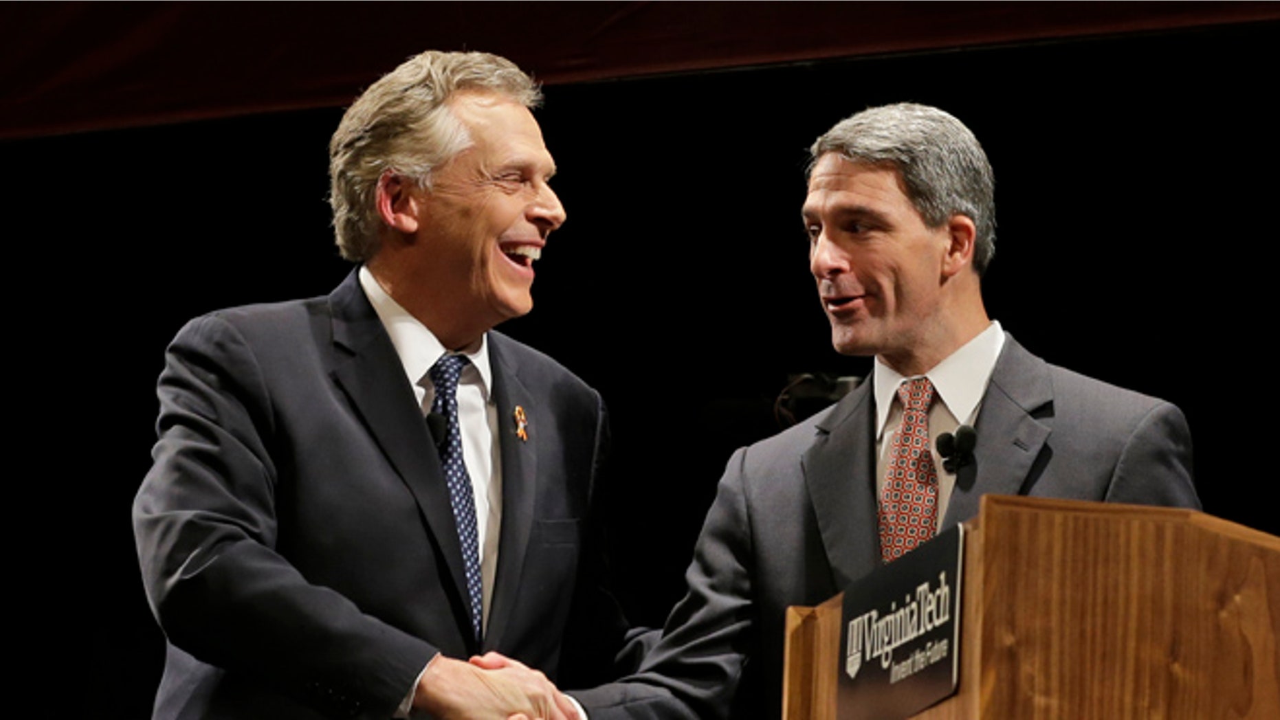 FILE: Oct. 24, 2013: Democratic gubernatorial candidate Terry McAuliffe, left, shakes hands with Republican challenger Virginia Attorney General Ken Cuccinelli at a debate at Virginia Tech in Blacksburg, Va.
