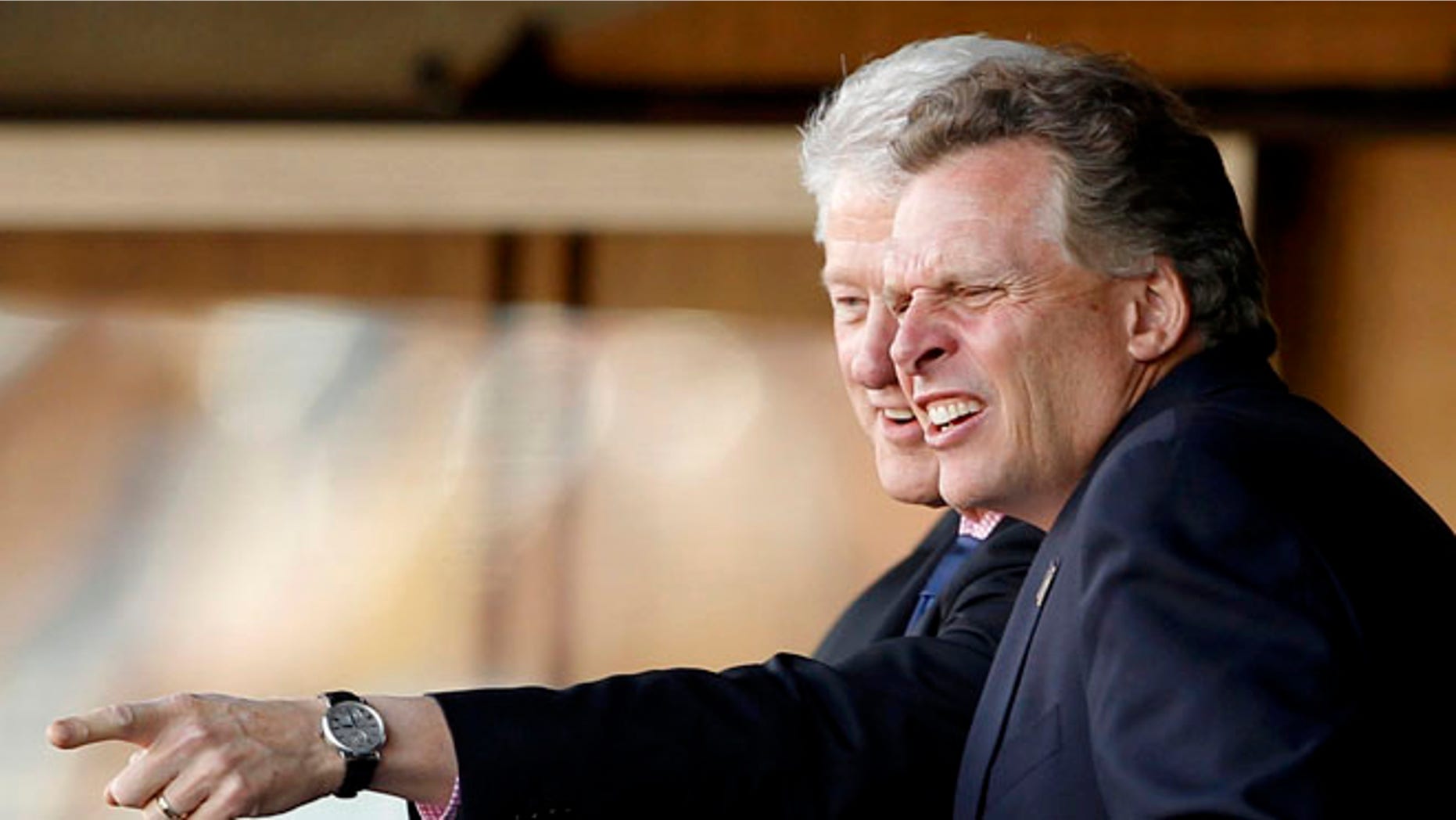 FILE: June 23, 2010: Virginia gubernatorial candidate Terry McAuliffe (D) in front of former President Bill Clinton in Pretoria, South Africa.