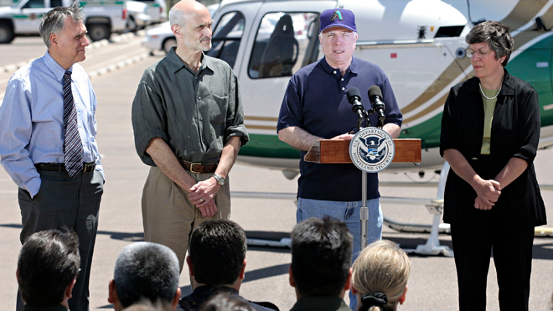 DOUGLAS, AZ - MAY 5: U.S. Senator John McCain (R-AZ.) (Center-R) introduces U.S. Secretary of Homeland Security Michael Chertoff (Center-L) at the U.S. Border Patrol Station May 5, 2005 in Douglas, Arizona. Chertoff toured the border at Douglas and Yuma, Arizona and U.S. Border Patrol facilities along with U.S. Senator John McCain (R-AZ.), U.S. Senator Jon Kyl (R-AZ.) and Arizona Governor Janet Napolitano. (Photo by Jeff Topping/Getty Images)