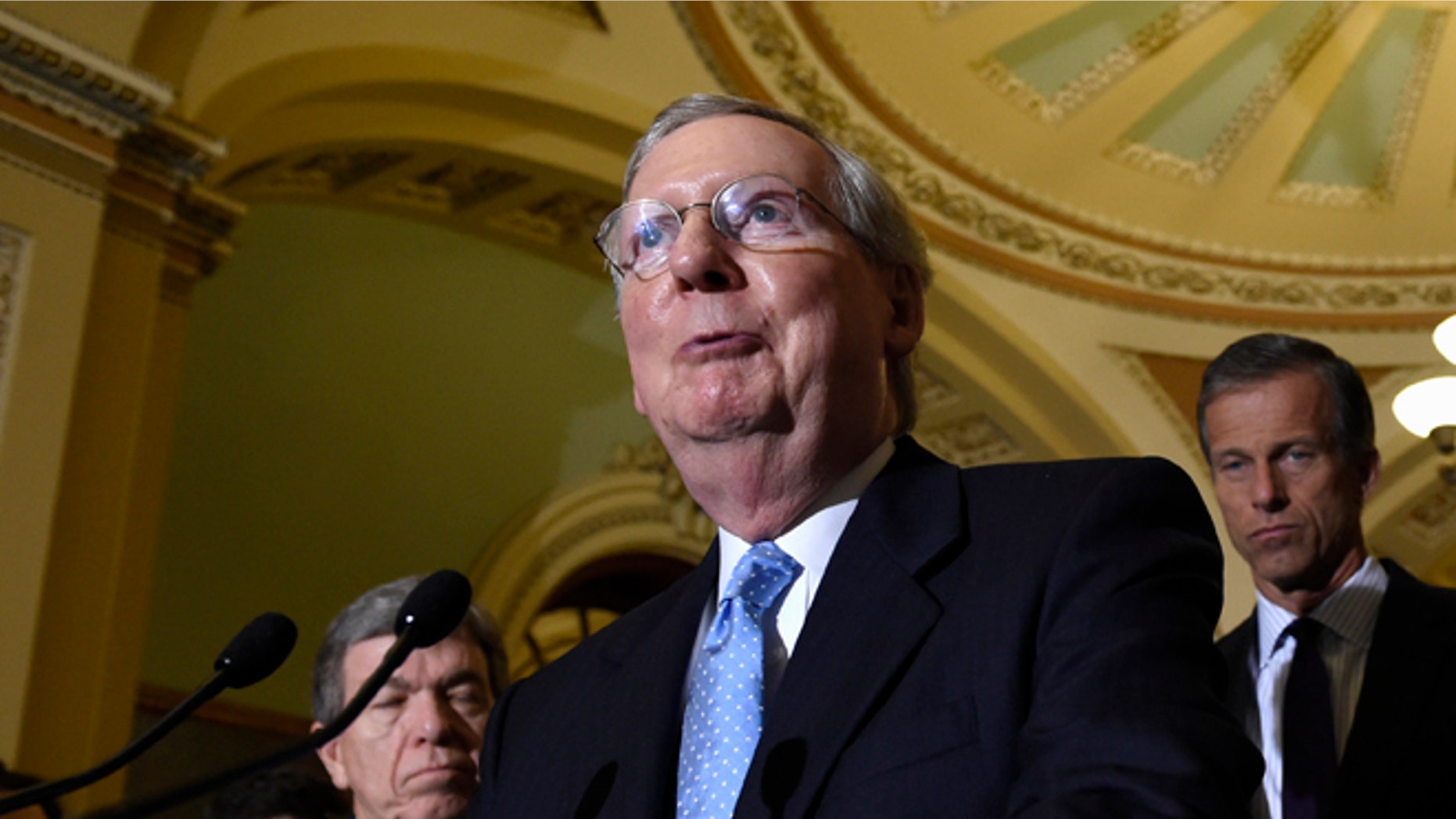 Senate Majority Leader Mitch McConnell of Ky., second from left, speaks to reporters following the weekly Republican luncheon on Capitol Hill in Washington, Tuesday, June 16, 2015. (AP Photo/Susan Walsh)