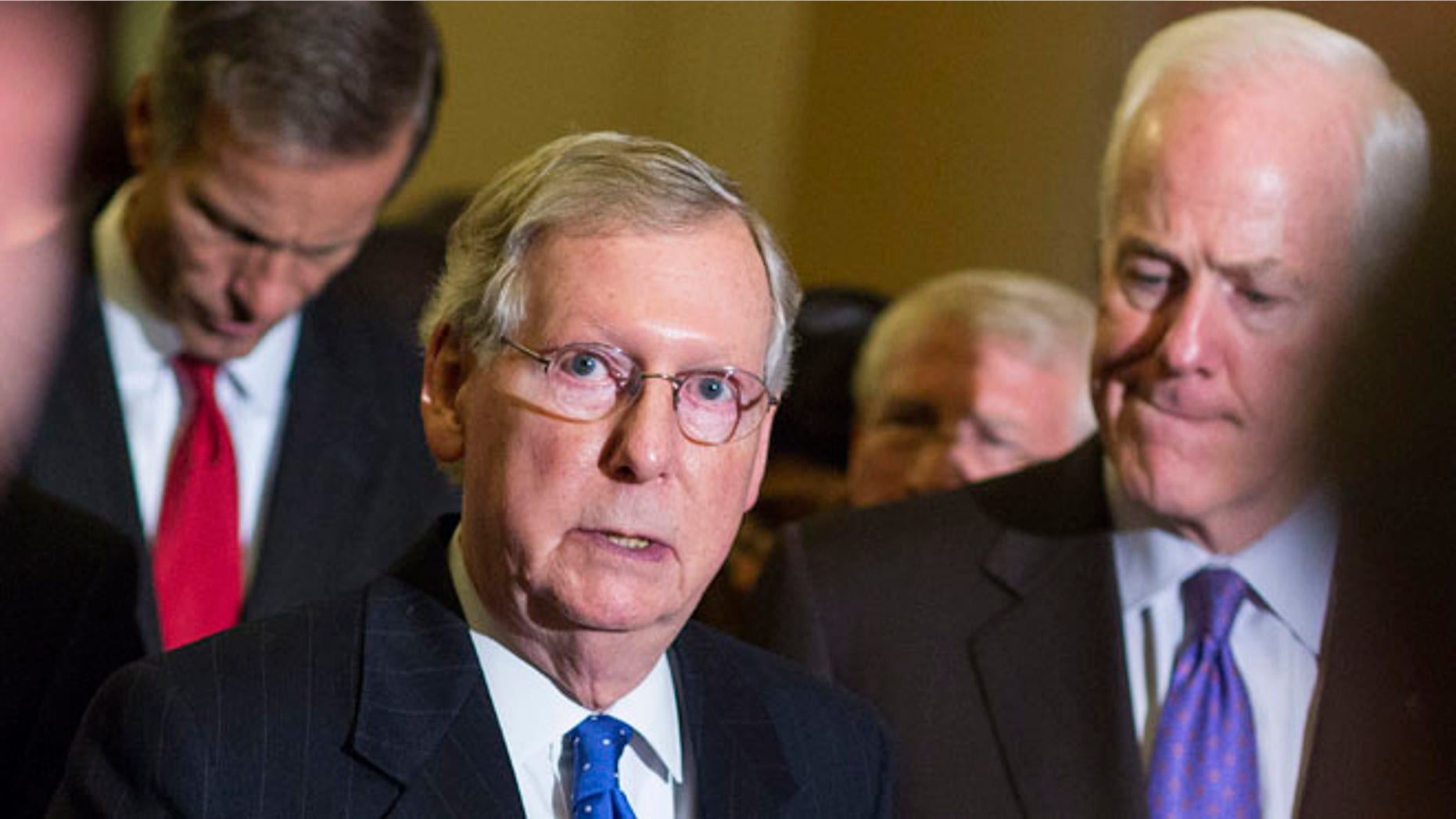FILE: Nov. 13, 2014: Senate Minority Leader Mitch McConnell, R-K.Y., with GOP Sens. John Thune, S.D., and John Cornyn, Texas, on Capitol Hill, in Washington, D.C.