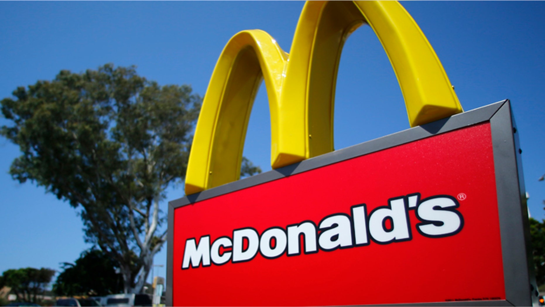A McDonald's sign is shown at the entrance to one of the company's restaurants in Del Mar, California September 10, 2012. REUTERS/Mike Blake (UNITED STATES - Tags: BUSINESS LOGO) - RTR37SNF
