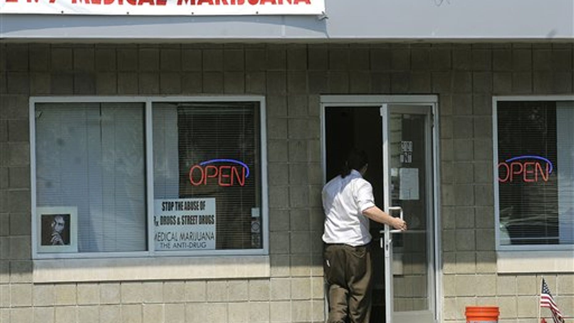August 24: A man walks into TNT, a medical marijuana dispensary on Michigan Avenue in Lansing, Mich.