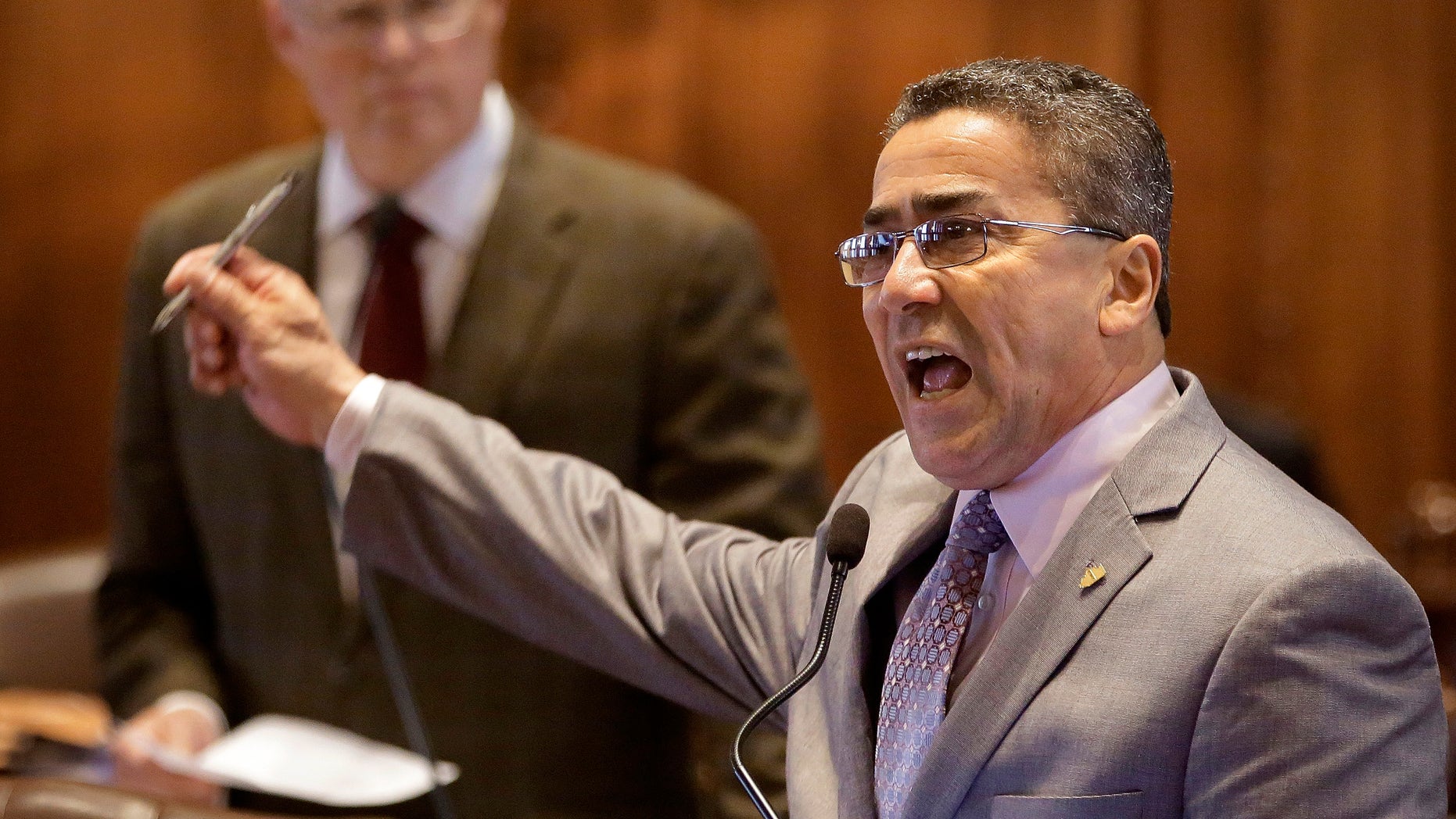 Illinois Sen. William Delgado, D-Chicago, agues medical marijuana legislation while on the Senate floor during session at the Illinois State Capitol Friday, May 17, 2013 in Springfield, Ill. (AP Photo/Seth Perlman)