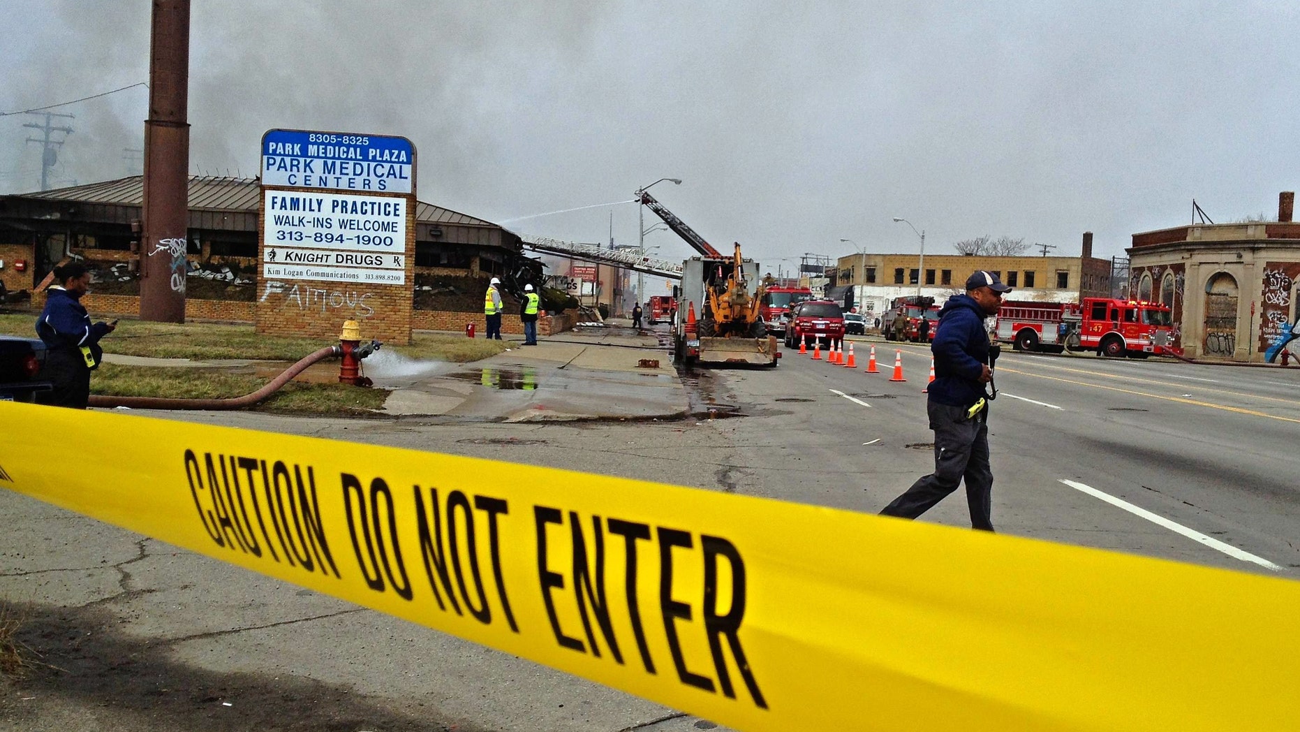 April 9, 2013: Caution tape lines the scene as a fire burns at Park Medical Centers building in Detroit. Two people remain unaccounted for in the gutted medical office building after a possible shooting and intentionally set fire, police said.