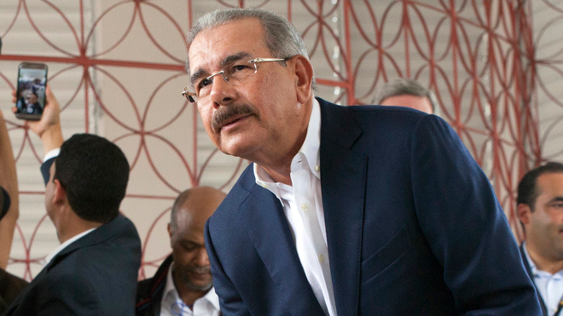 Danilo Medina casts his ballot during the general elections in Santo Domingo, Sunday, May 15, 2016.