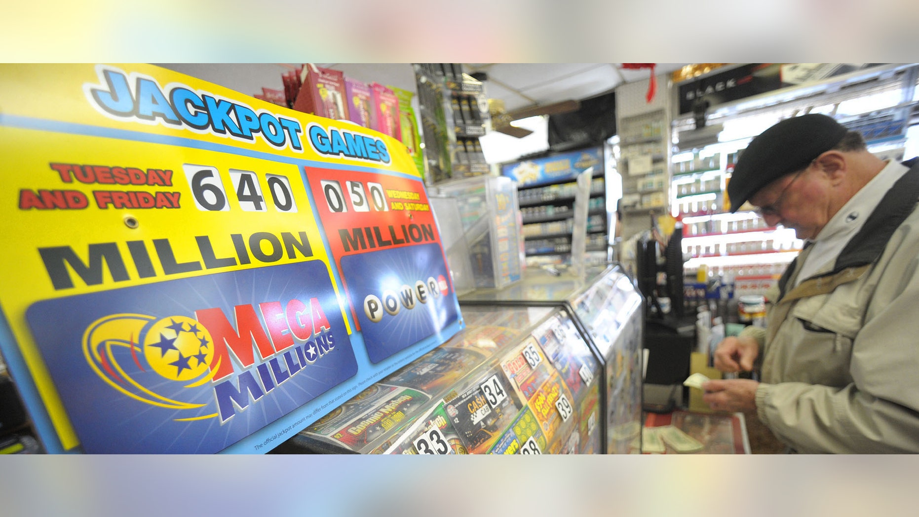 A man checks his Mega Millions ticket before leaving Towne Market, Friday, March 30, 2012 in Phillipsburg, N.J. Lottery ticket lines swelled as the record Mega Millions jackpot grew to $640 million, thanks greatly to players who opened their wallets despite long odds of success. Officials estimated ticket-buyers will have spent more than $1.46 billion on the jackpot by the time Friday night's numbers are drawn. (AP Photo/The Express-Times, Matt Smith)