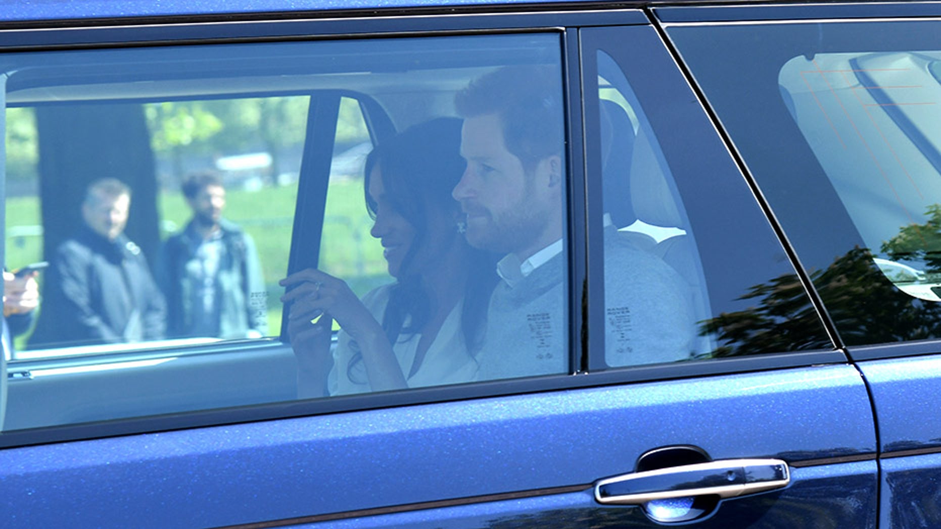 Meghan Markle wore $10,000 earrings and white blouse upon arrival in Windsor for the royal wedding rehearsal.
