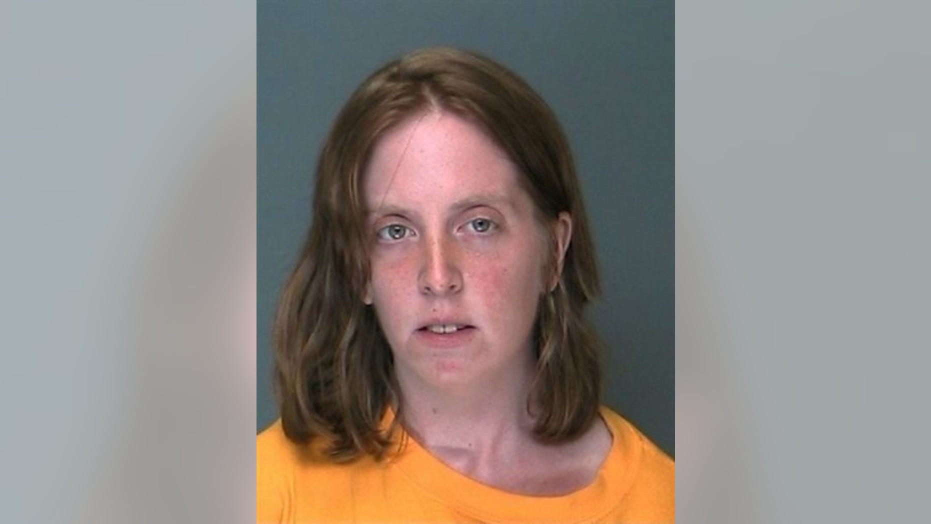 This photo provided by the Suffolk County Police Department Thursday, June 23, 2010 shows Melinda Brady, who was arrested along with her husband David Laffer the previous day in connection with the killing of four people during a robbery for painkillers at a pharmacy in Medford, N.Y. Brady said, "He was doing it because he lost his job and I was sick," as she was led from Suffolk police headquarters in Yaphank, N.Y. She was charged with robbery and obstructing governmental administration, (AP Photo/Suffolk County Police Department)