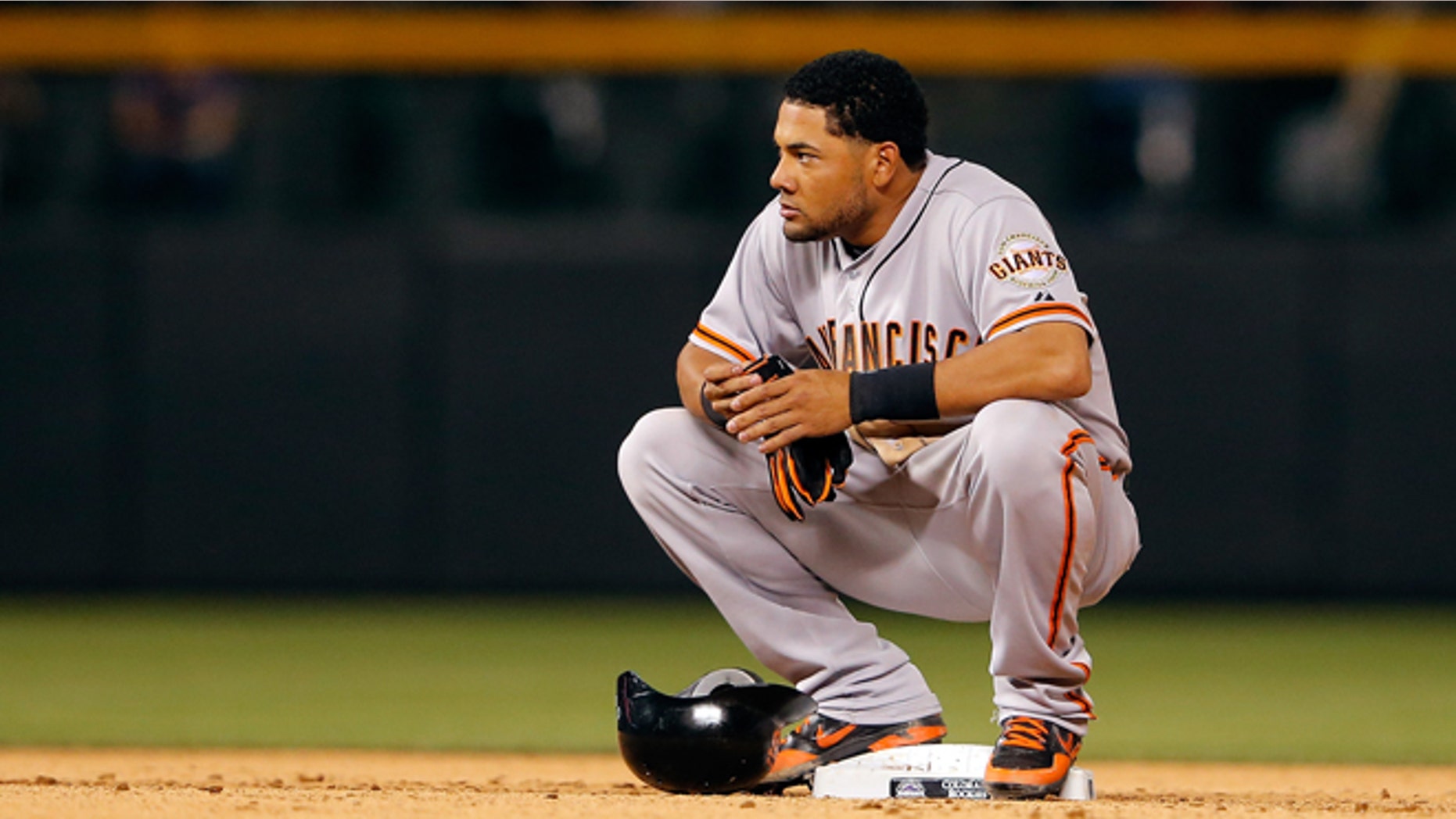 DENVER, CO - AUGUST 03: Melky Cabrera #53 of the San Francisco Giants pauses at second base after doubling against the Colorado Rockies at Coors Field on August 3, 2012 in Denver, Colorado. The Giants defeated the Rockies 16-4. (Photo by Doug Pensinger/Getty Images)