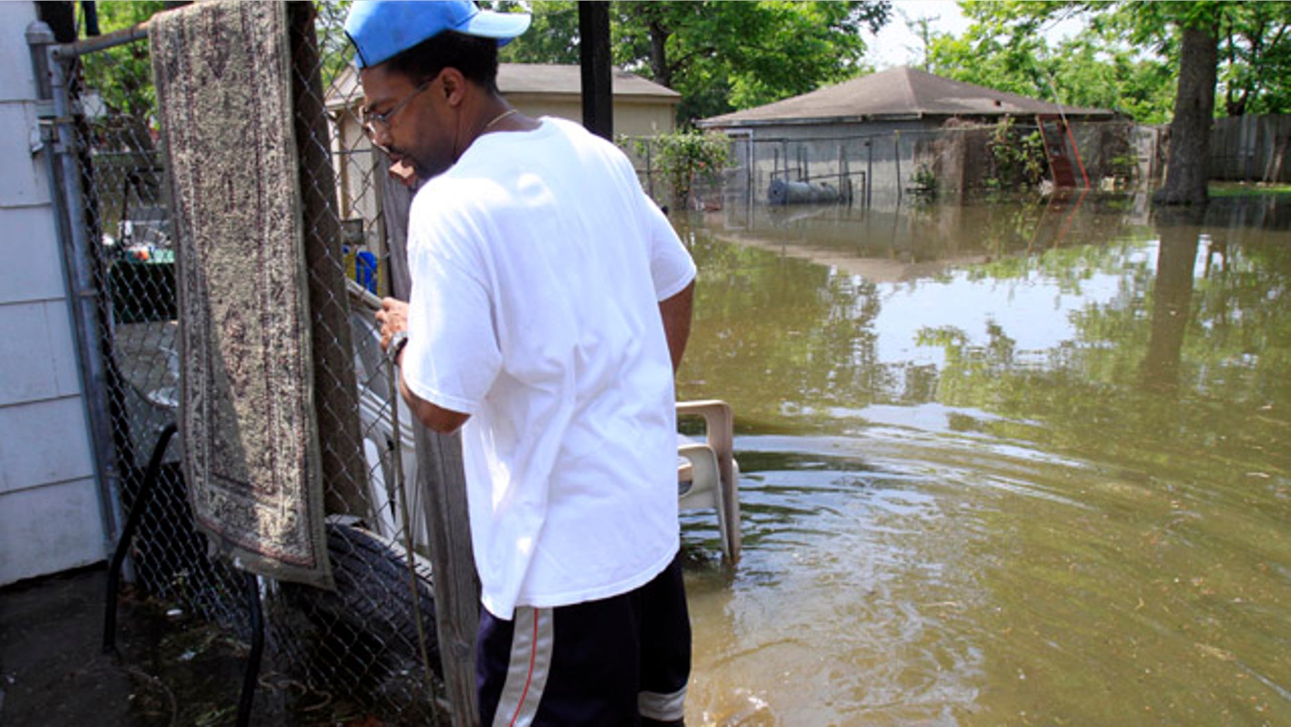 May 8: Gary Dugger walks in his flooded backyard in Memphis, Tenn. Dugger was hoping to wait out the flood in his home but rising water has forced him to flee for higher ground as the mighty Mississippi River edged toward the city, threatening to bring more flooding to parts of an area already soaked.