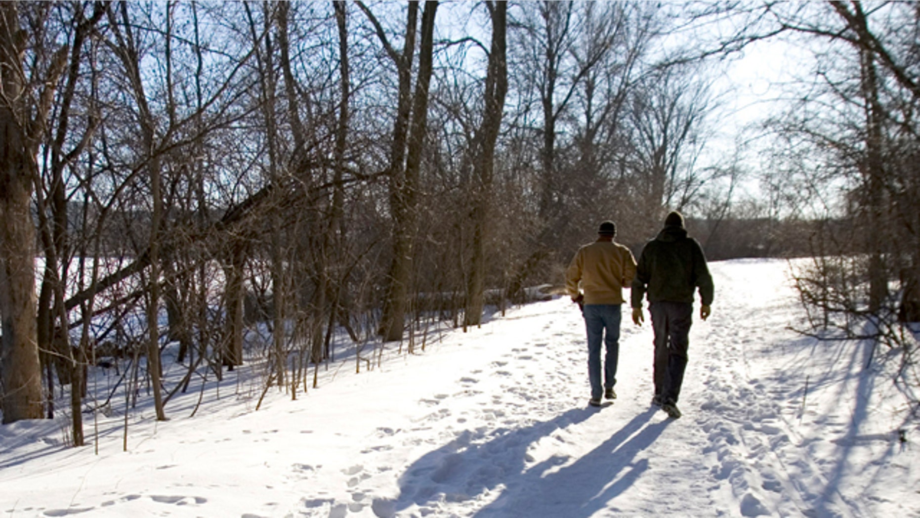 Brothers Rink, left, and Jim DaVee walk on a snow-covered trail Wednesday, March, 7, 2007, in Madison, Wis. Prevention magazine has named Madison as the most walkable of the country's 100 most populated cities. (AP Photo/Andy Manis)