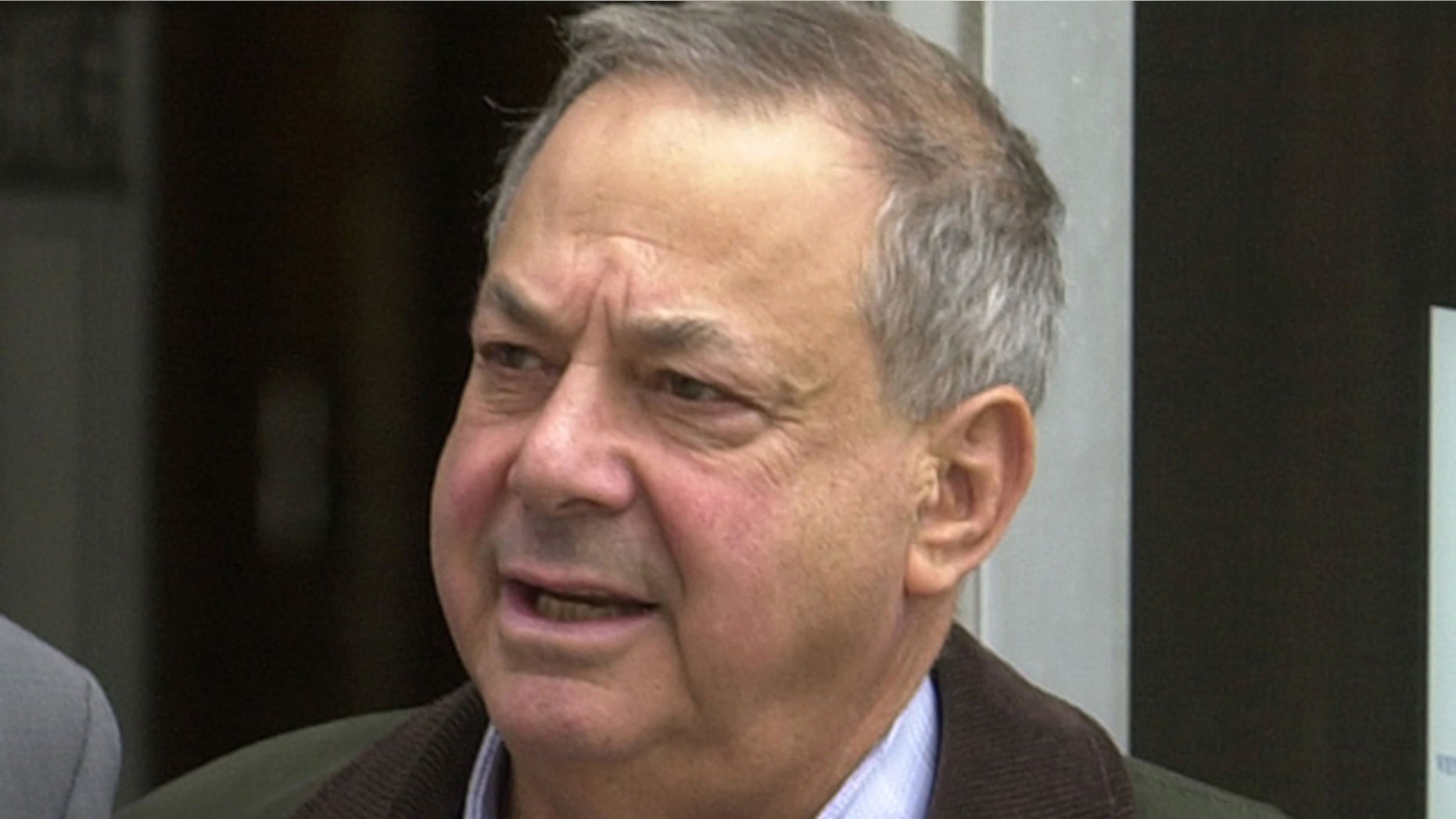 FILE - In this Oct. 15, 2003, file photo, Joseph Barry, president of Applied Development Co., of Hoboken, N.J., leaves the U.S. District Courthouse in Newark, N.J. Sen. Bob Menendez's legal defense fund raised nearly $1.3 million up until the day before he was indicted on bribery and corruption charges, including $10,000 from the retired Barry who served two years in prison for bribery. (AP Photo/Mike Derer, File)