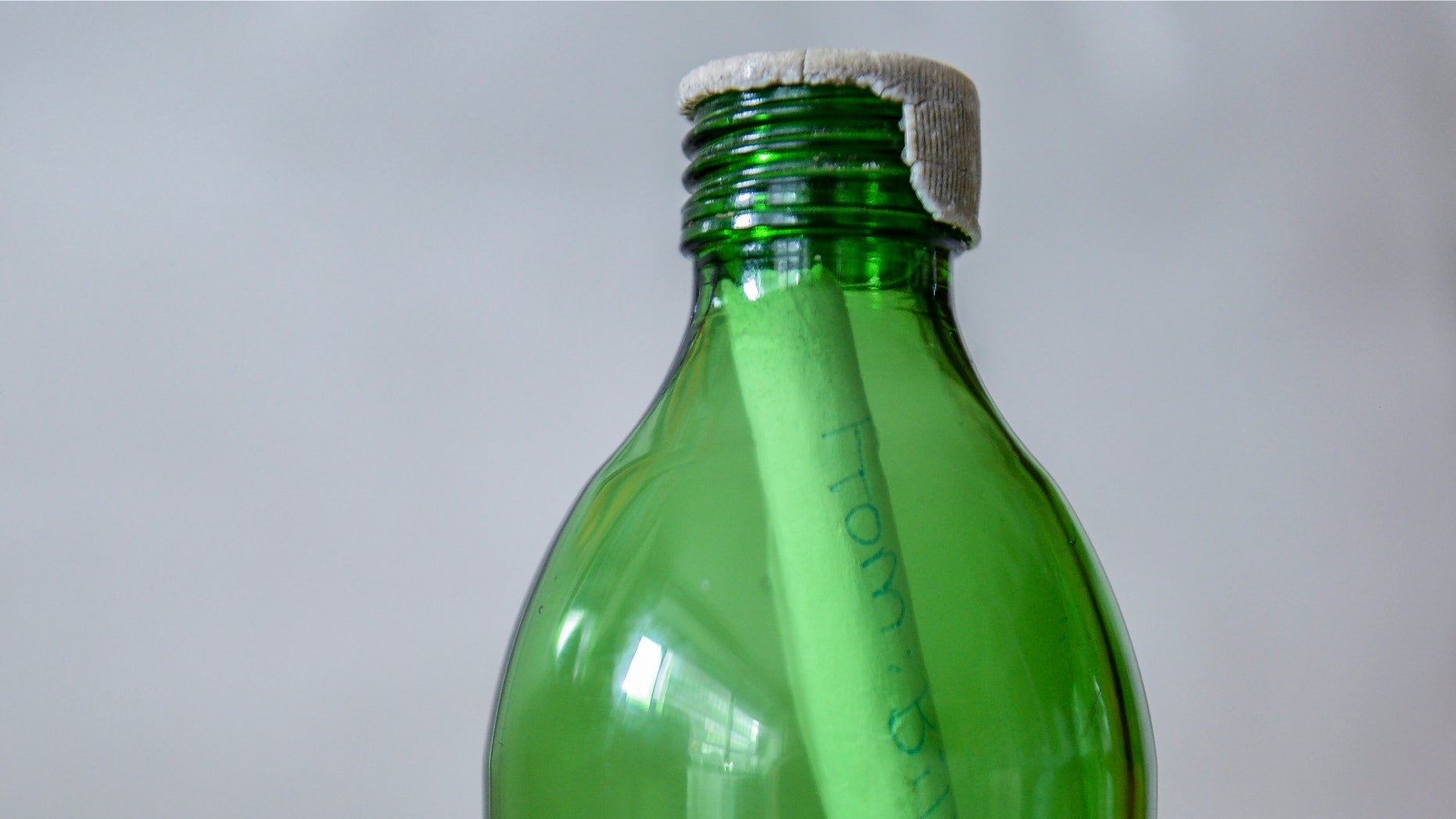 NEW YORK, NY - JULY 12: In this photo illustration, a bottle with a rolled up message, written by Mimi Fery's deceased daughter Sidonie Fery, is seen at Fery's home July 12, 2013 in New York City. Patchogue parks workers found Sidonie's message, "Be excellent to yourself, dude," along with a phone number within a bottle that had washed up with Hurricane Sandy debris and got in touch with Fery to deliver back to her. (Photo illustration by Larry Busacca/Getty Images)